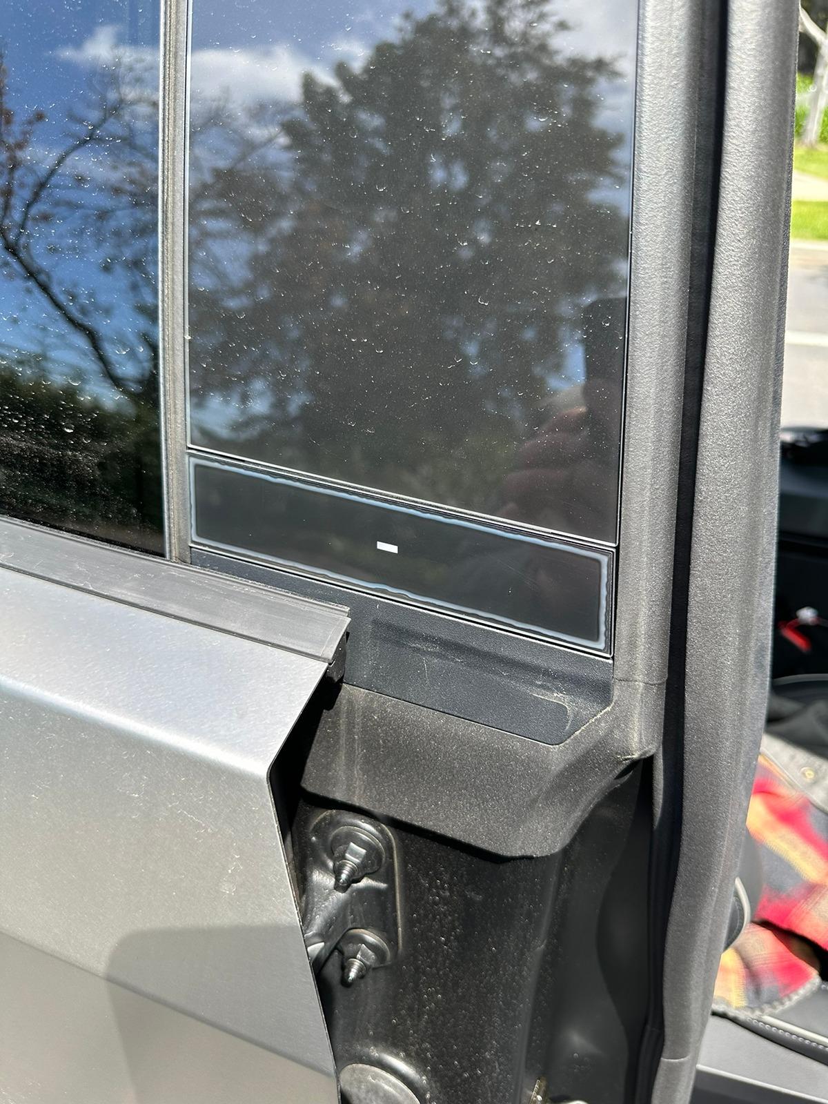 Tesla Cybertruck Adehshive showing in the door buttons? [FIXED] 1713228529330-gd