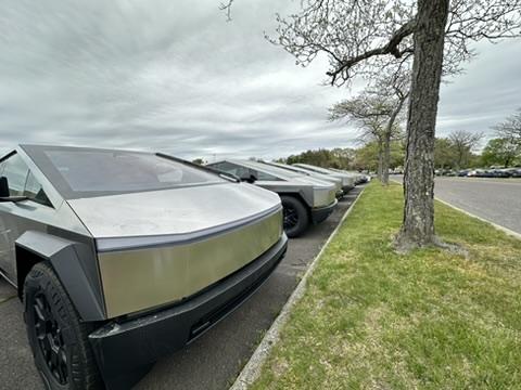 Tesla Cybertruck A cool dozen Cybertrucks in a holding lot for Lawrenceville NJ 81D0C607-39D1-46D2-9CEA-9E98B22B942E_4_5005_c