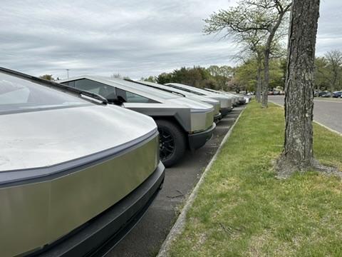 Tesla Cybertruck A cool dozen Cybertrucks in a holding lot for Lawrenceville NJ 3E116642-A5A6-410D-AB41-D92BF9B6F8A6_4_5005_c