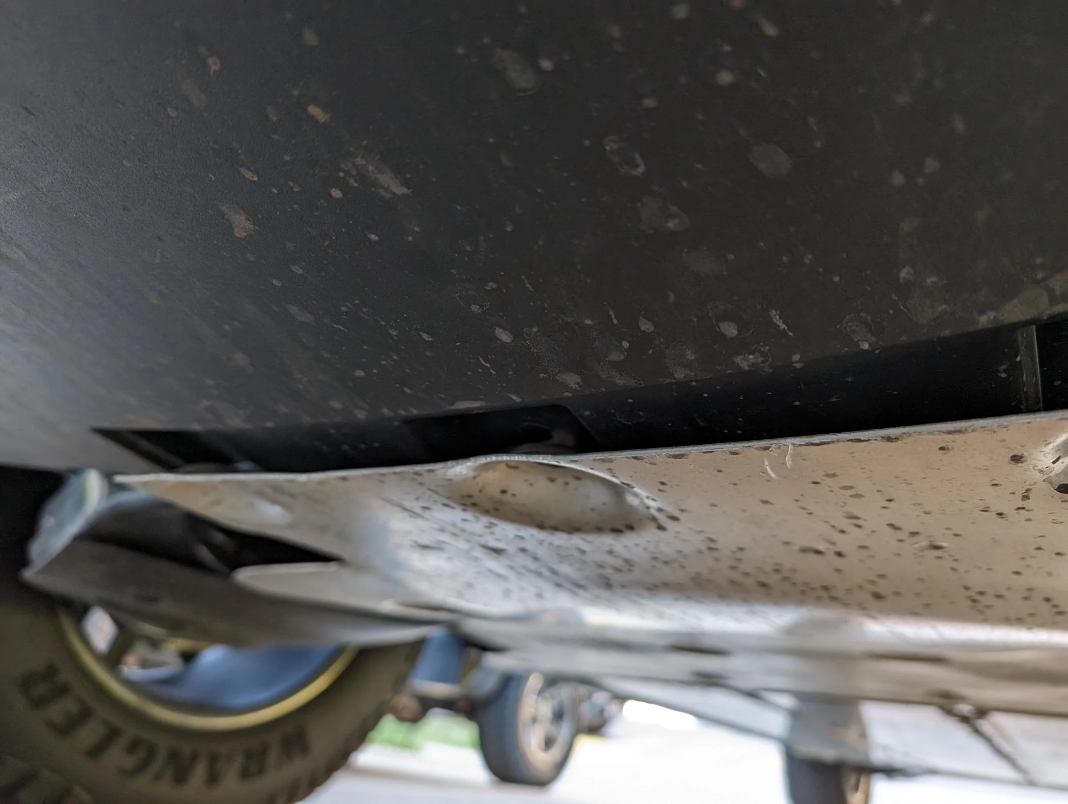 Tesla Cybertruck Rear metal undercarriage piece missing bolts and hanging down 1000007507