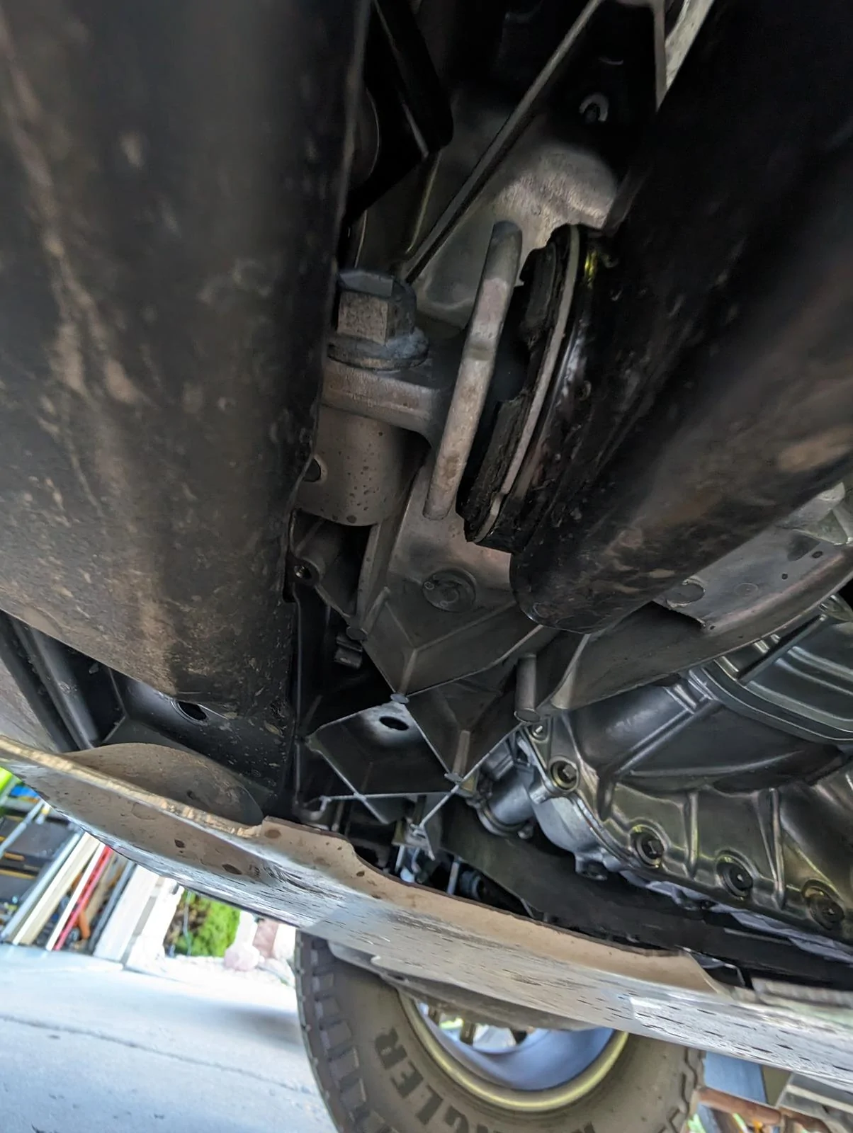 Tesla Cybertruck Rear metal undercarriage piece missing bolts and hanging down 1000007511