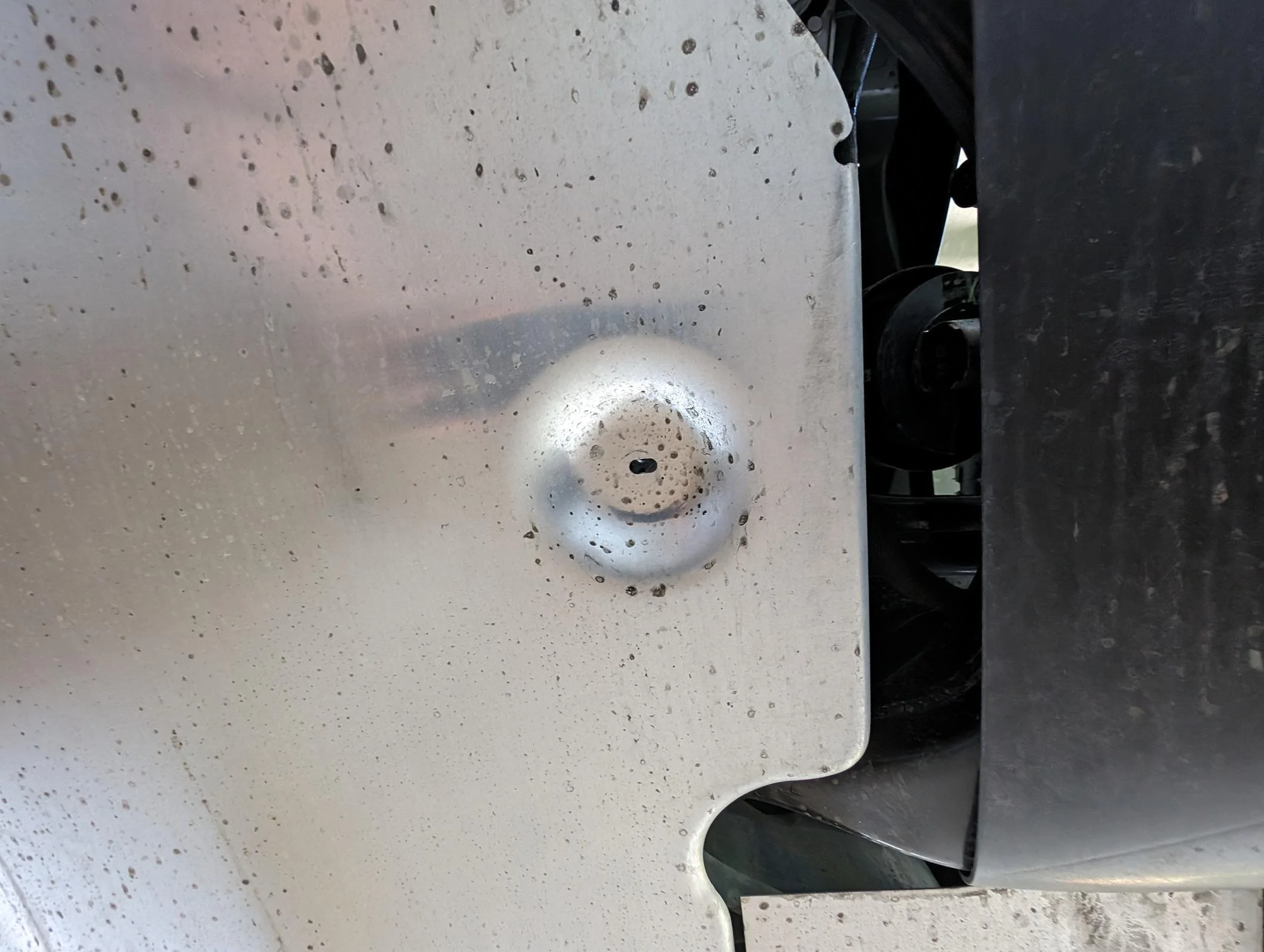 Tesla Cybertruck Rear metal undercarriage piece missing bolts and hanging down 1000007509