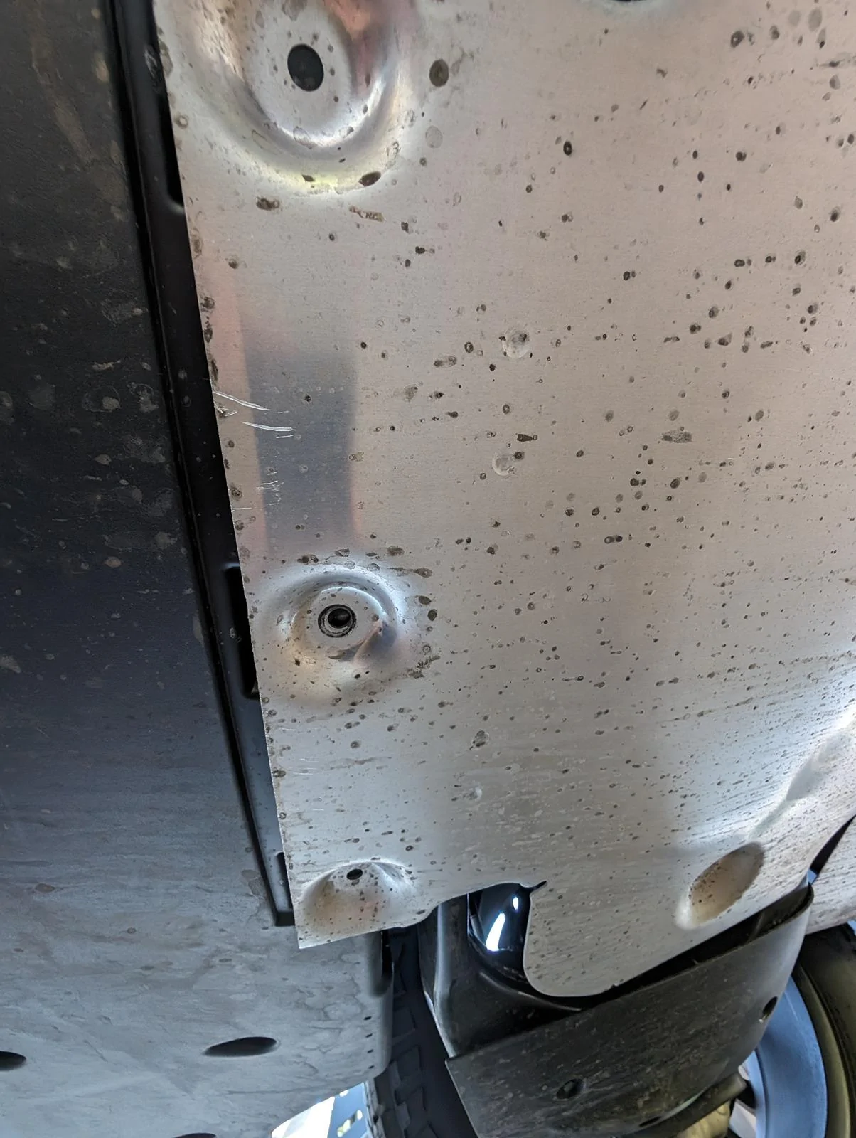 Tesla Cybertruck Rear metal undercarriage piece missing bolts and hanging down 1000007508
