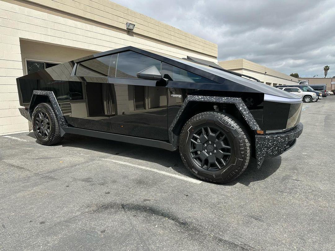 Cybertruck in STEK Dynoblack Gloss PPF + bumpers and fender flares in carbon fiber wrap 5.jpg