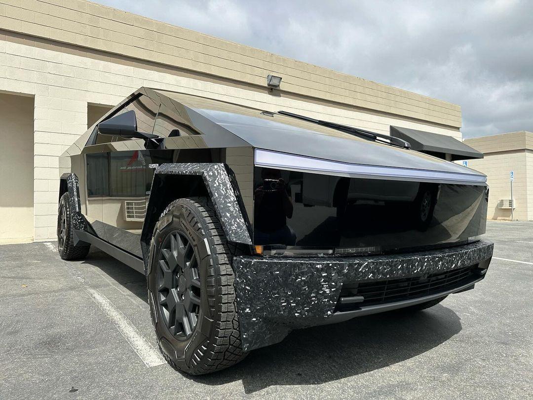 Cybertruck in STEK Dynoblack Gloss PPF + bumpers and fender flares in carbon fiber wrap 4.jpg