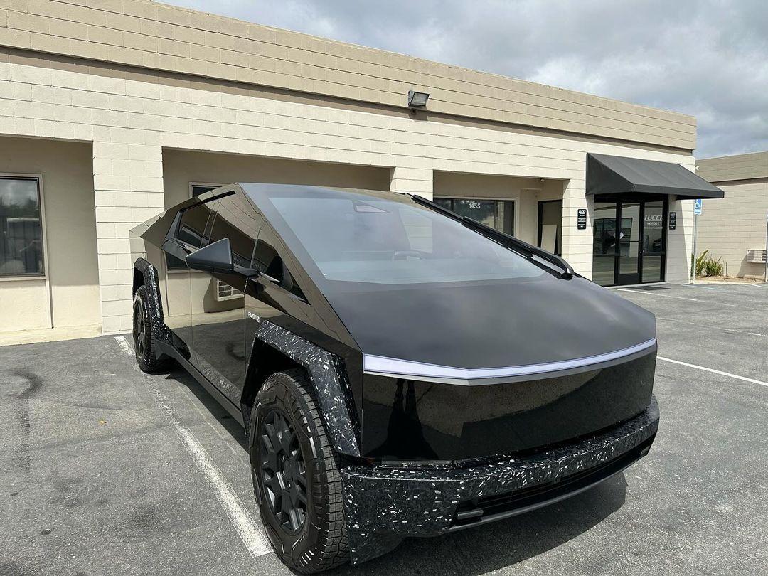 Cybertruck in STEK Dynoblack Gloss PPF + bumpers and fender flares in carbon fiber wrap 3.jpg