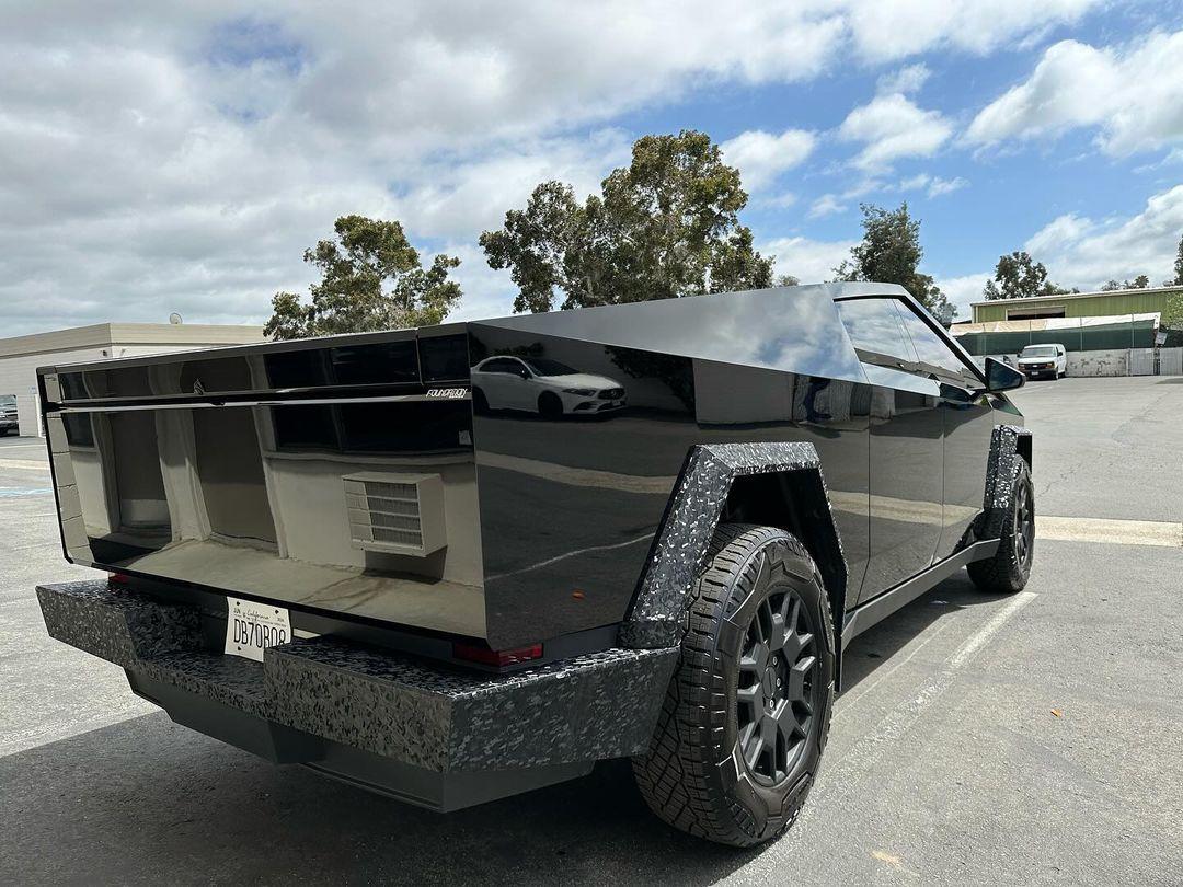 Cybertruck in STEK Dynoblack Gloss PPF + bumpers and fender flares in carbon fiber wrap 2.jpg