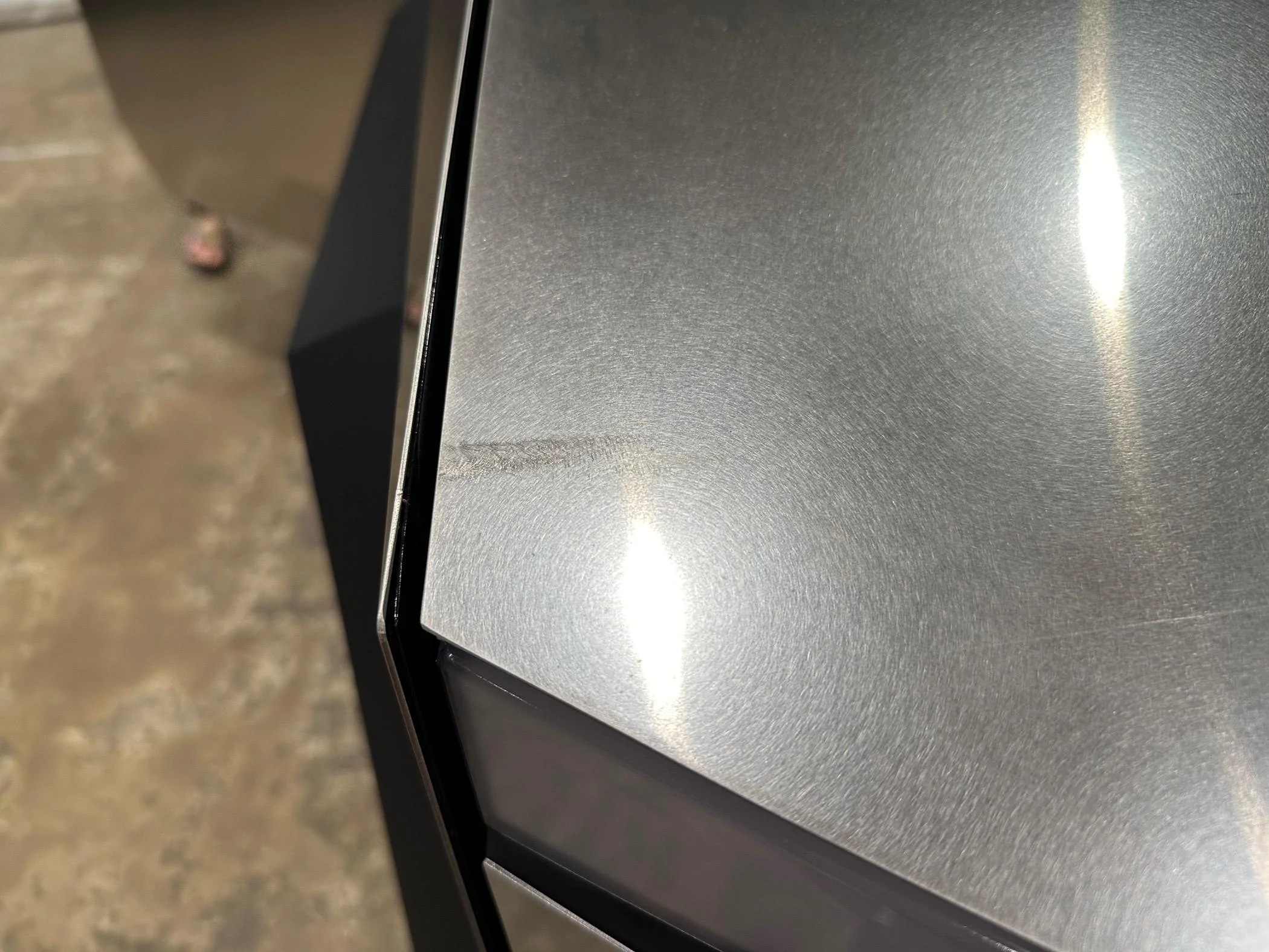 Tesla Cybertruck Big Scratches on SS at Delivery IMG_4224
