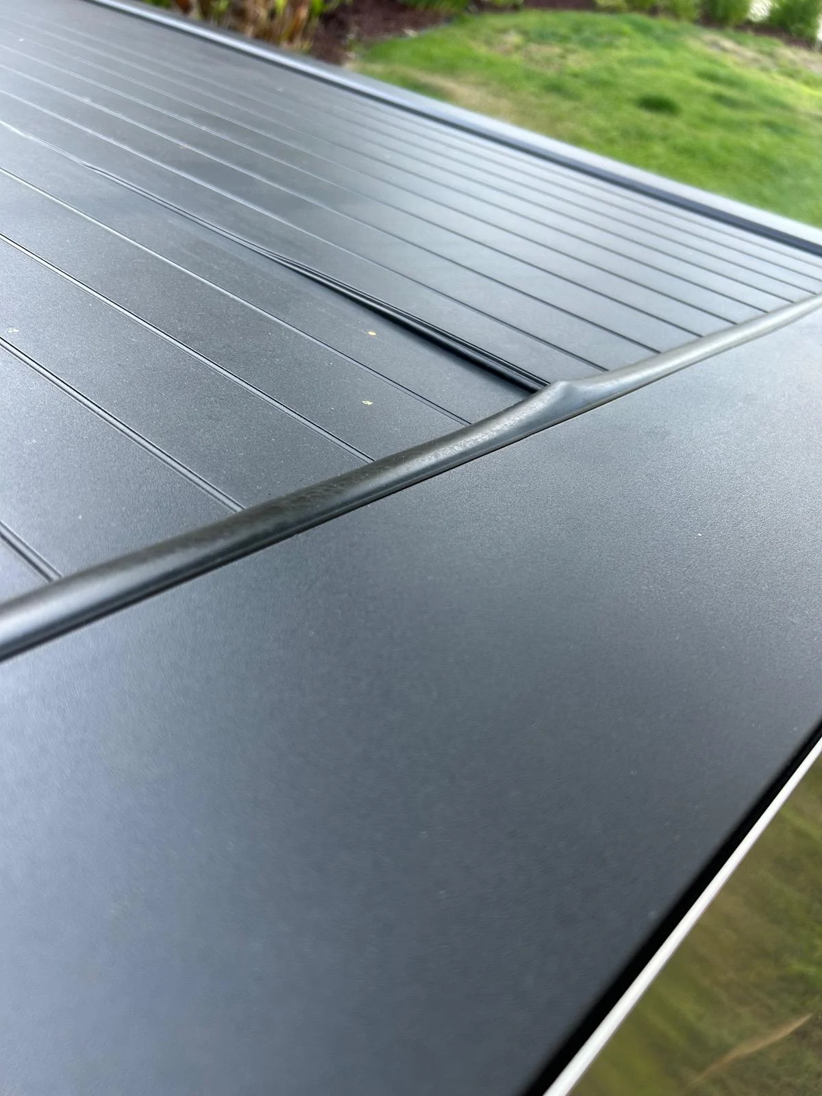 Tesla Cybertruck Tonneau Cover Weather Seals In between SLATS coming undone IMG_3540
