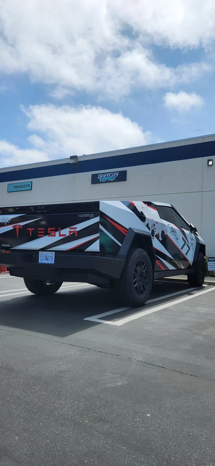 Tesla Cybertruck Beast custom printed wrap (Cerberus graphic) White 3M base and red painted calipers 20240530_145656