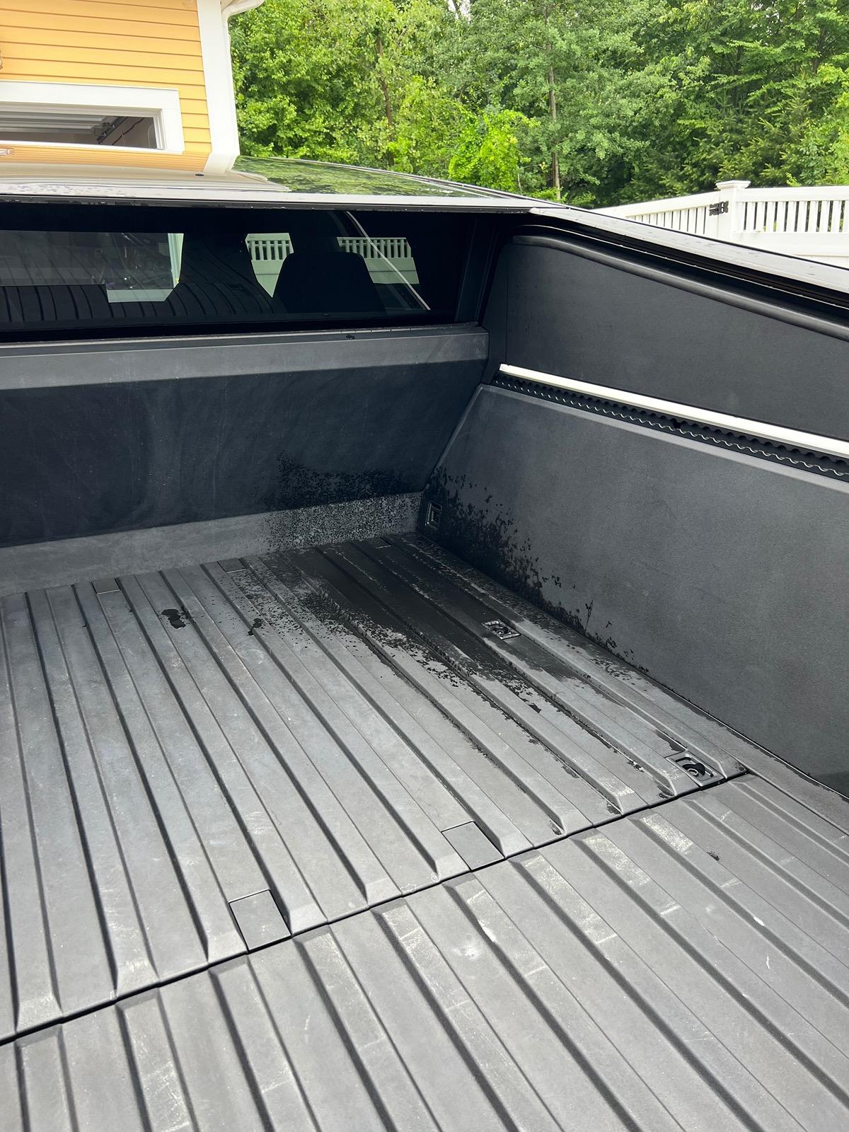 Tesla Cybertruck Water in truck bed after heavy rain or washing IMG_7439