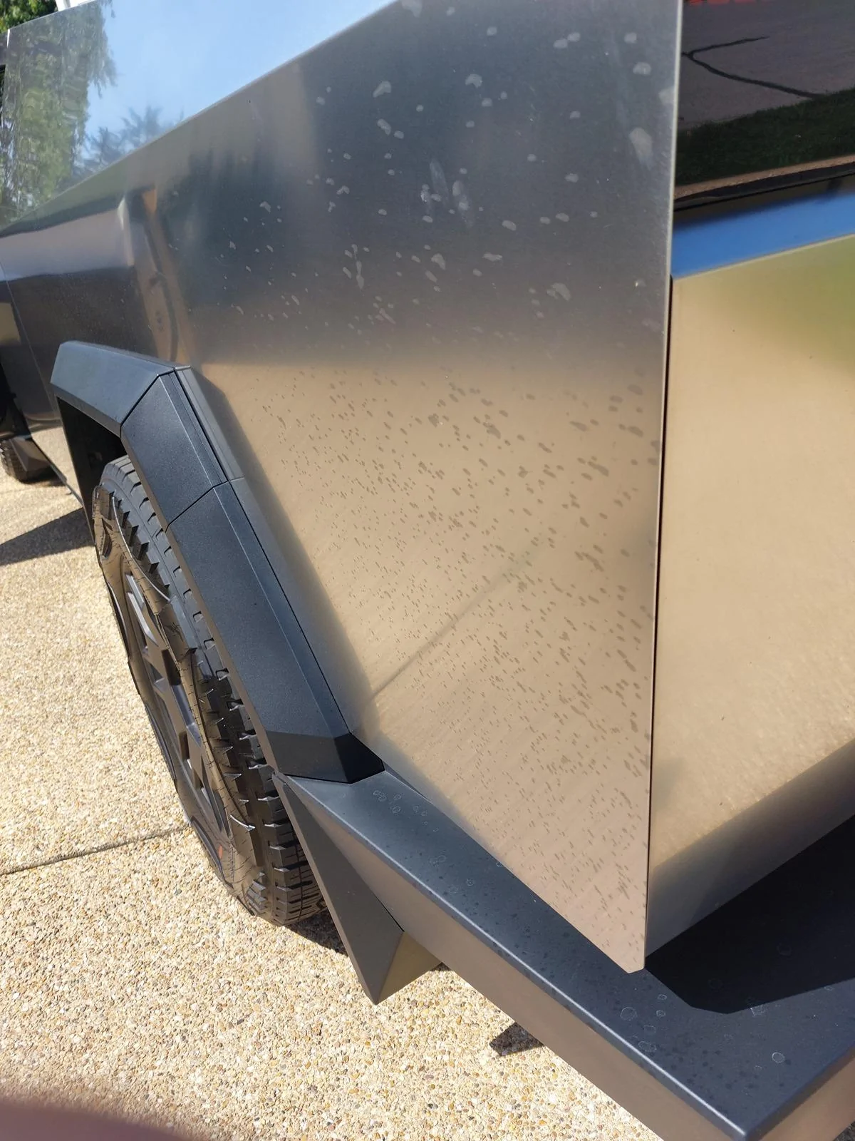 Tesla Cybertruck Black Spots on sides after going through car wash black spots