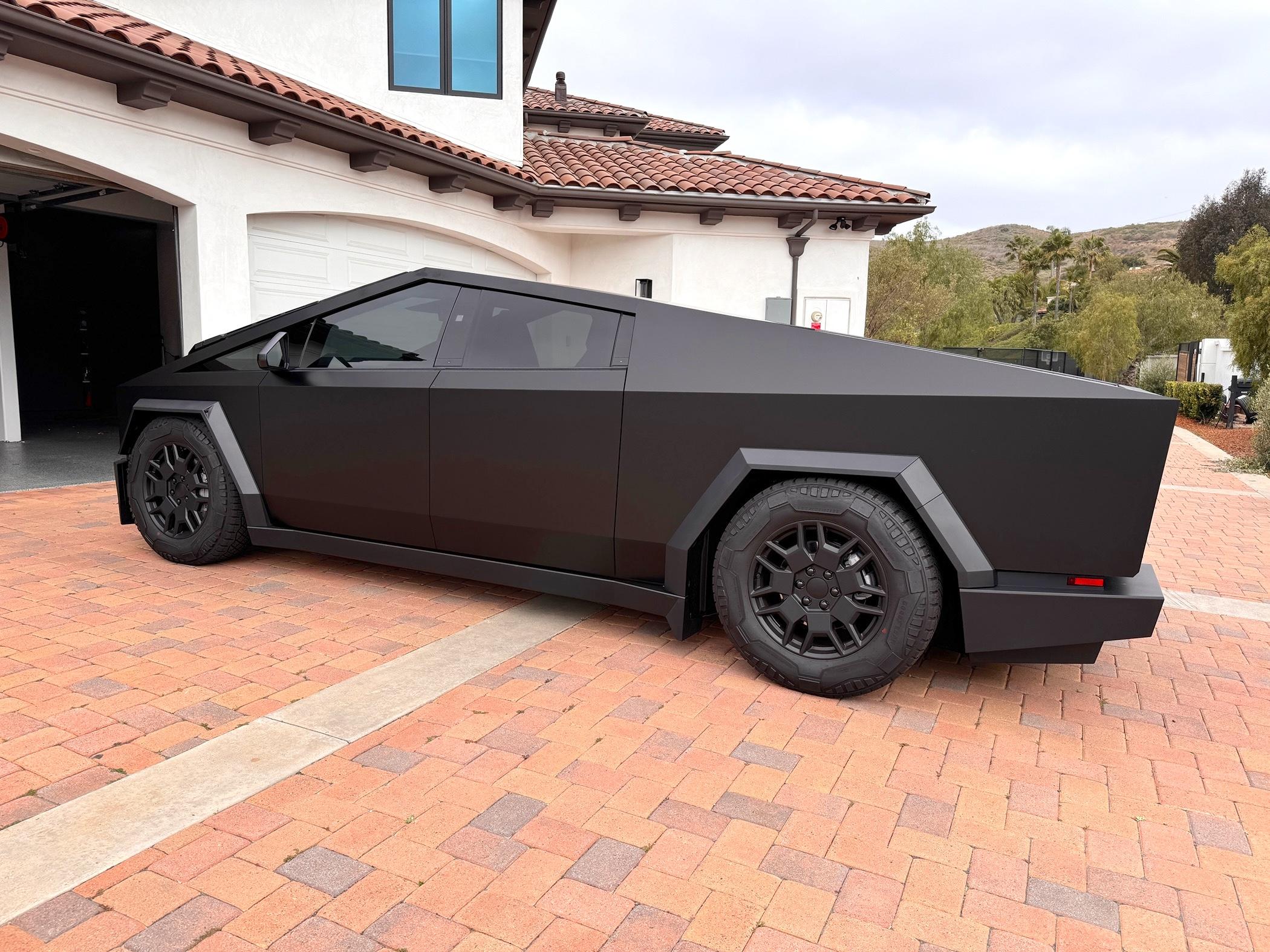 Tesla Cybertruck SLAMMED matte black Cybertruck on deflate all air suspension mode IMG_4540