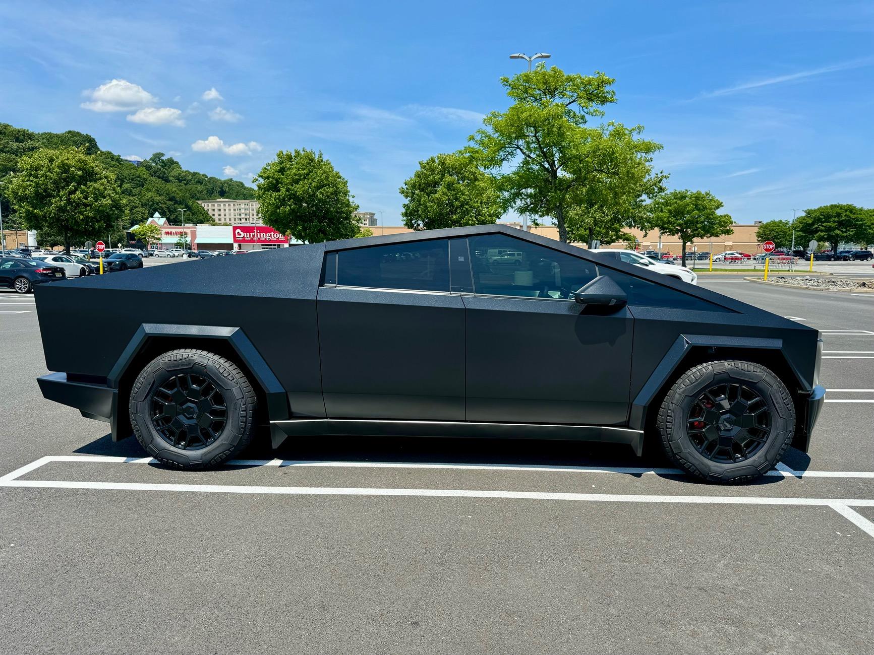 Tesla Cybertruck Satin Black Plasti Dip liquid wrapped body and plastics w/ all lights smoked out + gloss black liquid wrapped rims and red painted calipers IMG_1637