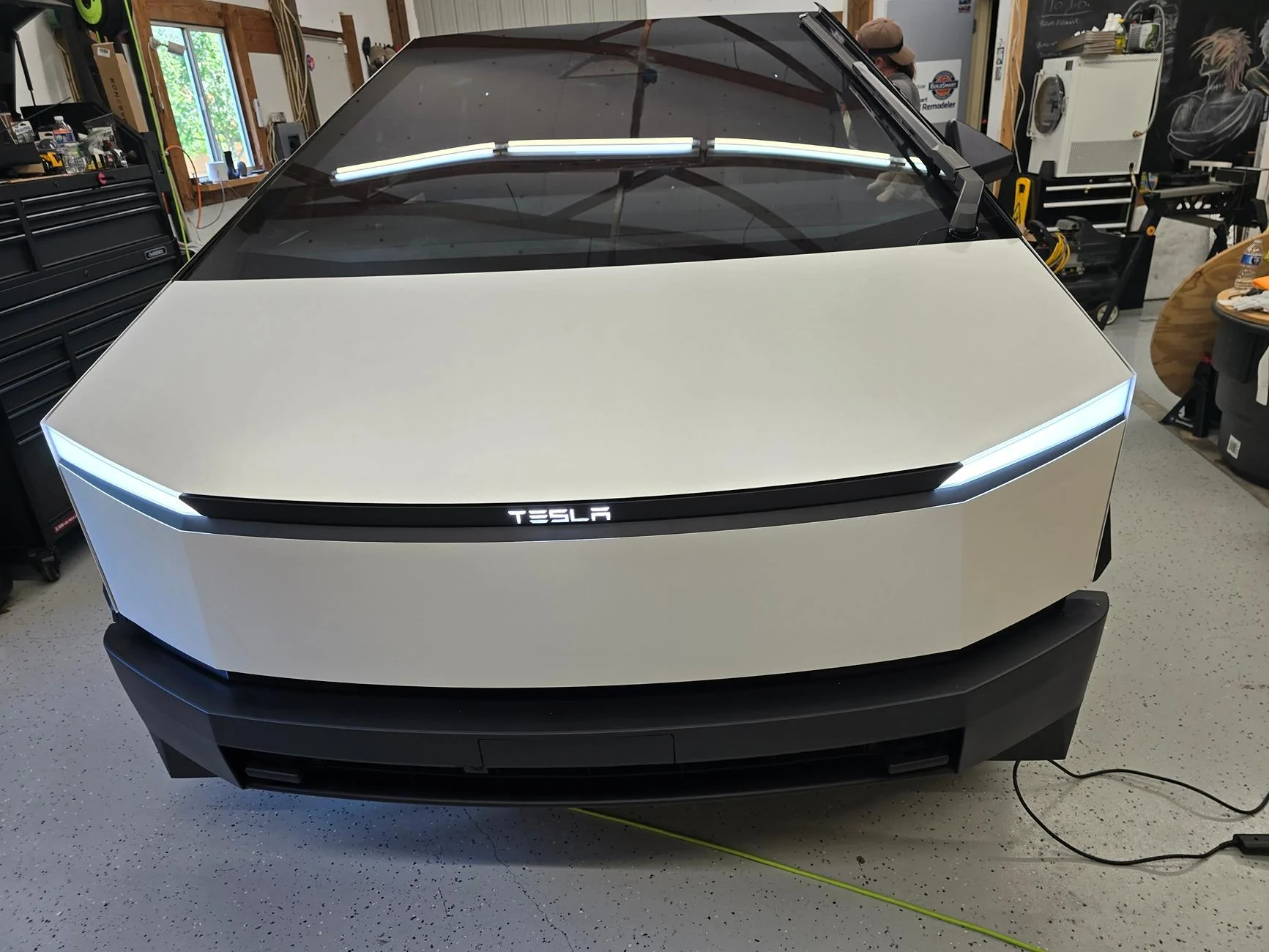 Tesla Cybertruck We did it! Pearl white wrap and Tesla logo on front lightbar 20240705_170418