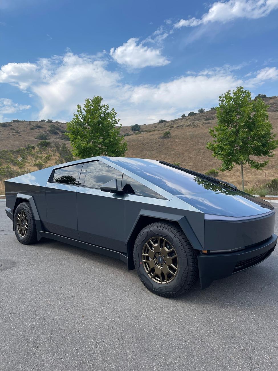 Tesla Cybertruck Powdercoated wheels in Lazer Bronze color (on UPPF Byron Bay Blue wrap Cybertruck) IMG_6597