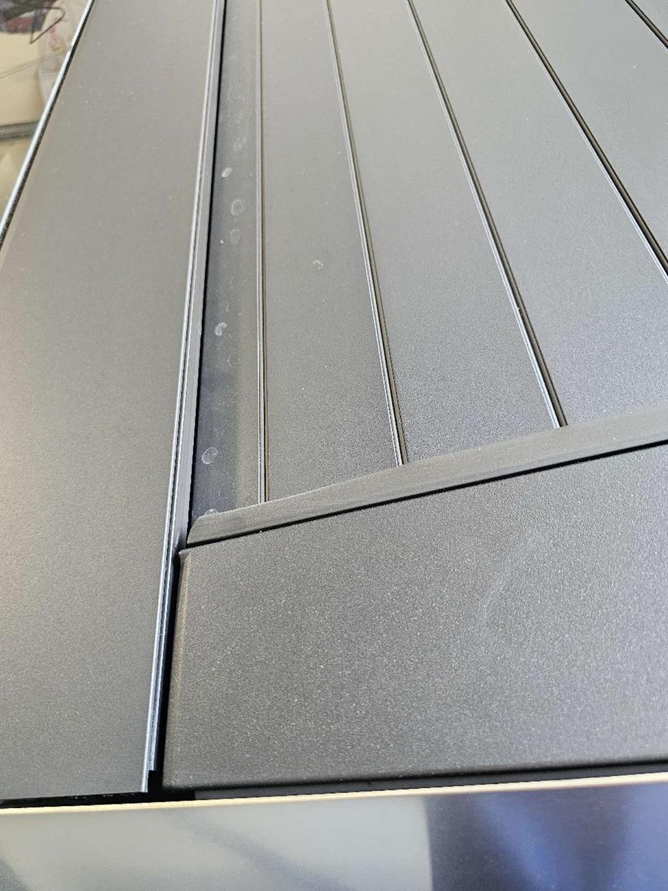 Tesla Cybertruck Tonneau cover leak DIY fix (cause: seal strip gap under aero flap) 20240714132552