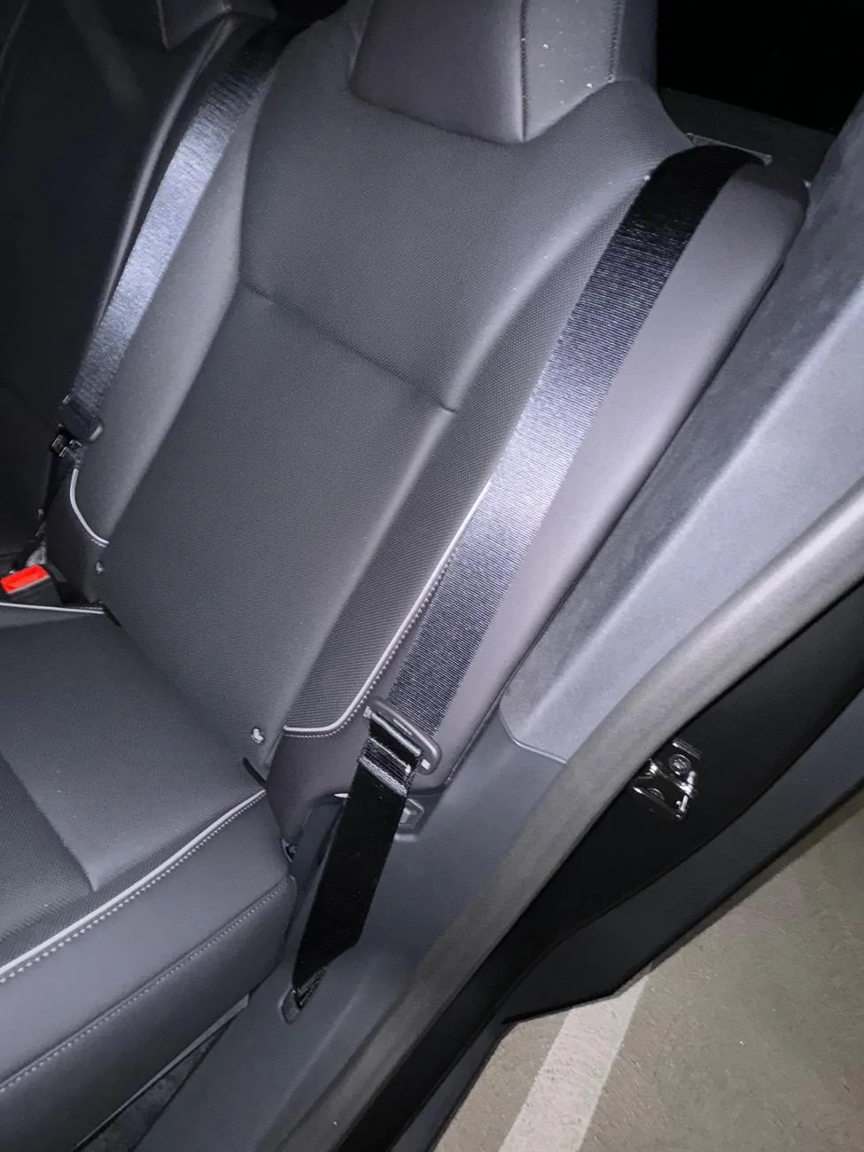 Tesla Cybertruck Seatbelts installed backwards in back? imag