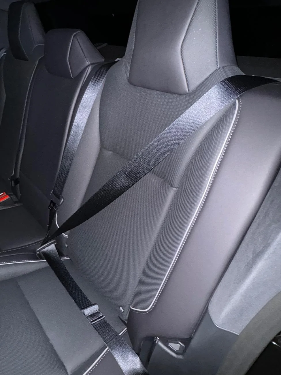 Tesla Cybertruck Seatbelts installed backwards in back? imag