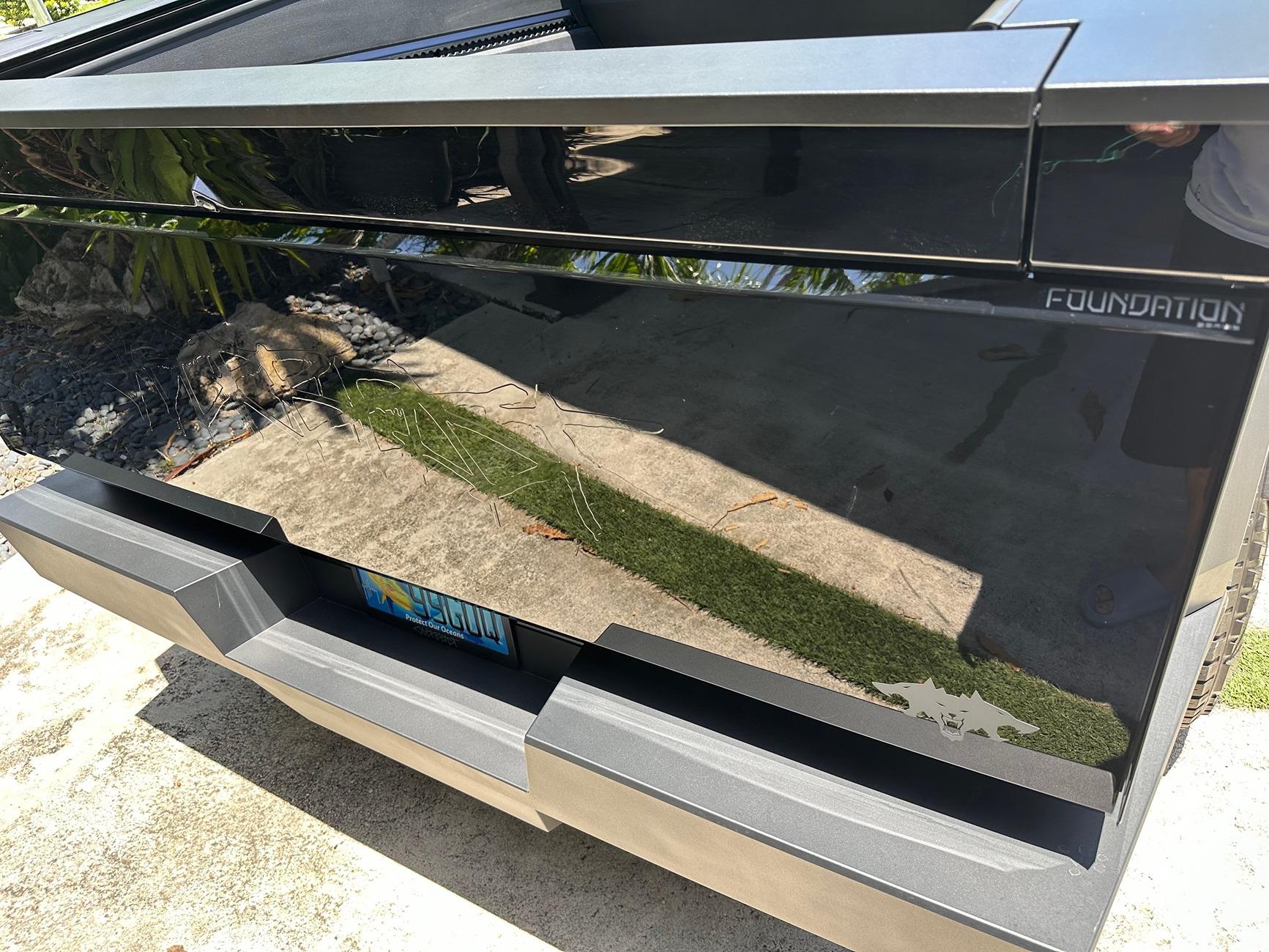 Tesla Cybertruck DIY PPF in Deep Gloss Black + 30% tint on DRL LED + Cyberbeast graffiti on tailgate under PPF cybertailgatejuly