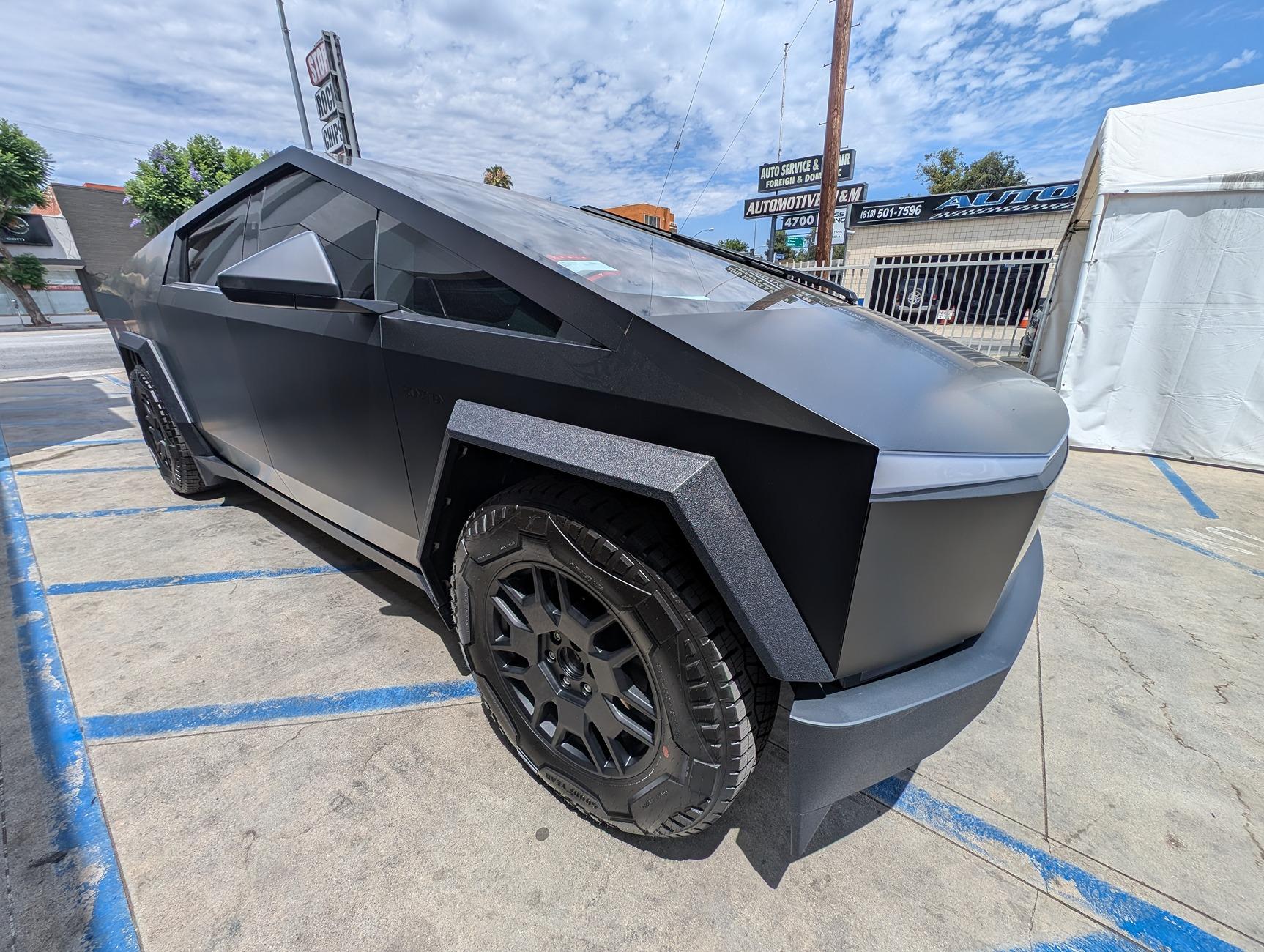 Tesla Cybertruck Let me introduce everyone to "Wraith" : 5% tint on doors, 70% ceramic on windshield, 3M Vinyl Satin Black wrap CYEB25~1.JPG