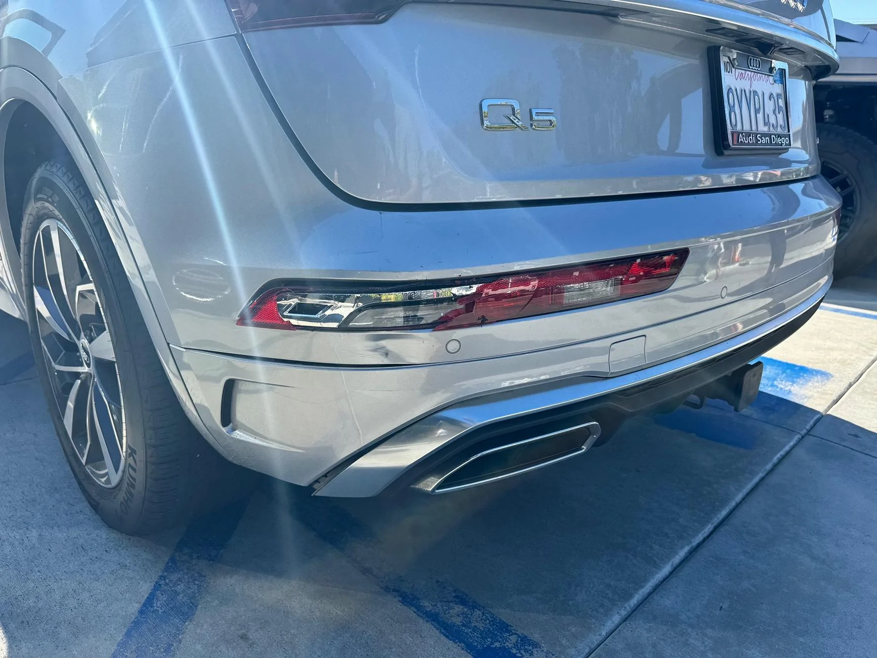 Tesla Cybertruck Front bumper hit in parking lot. Bumper replacement or repair? IMG_7634