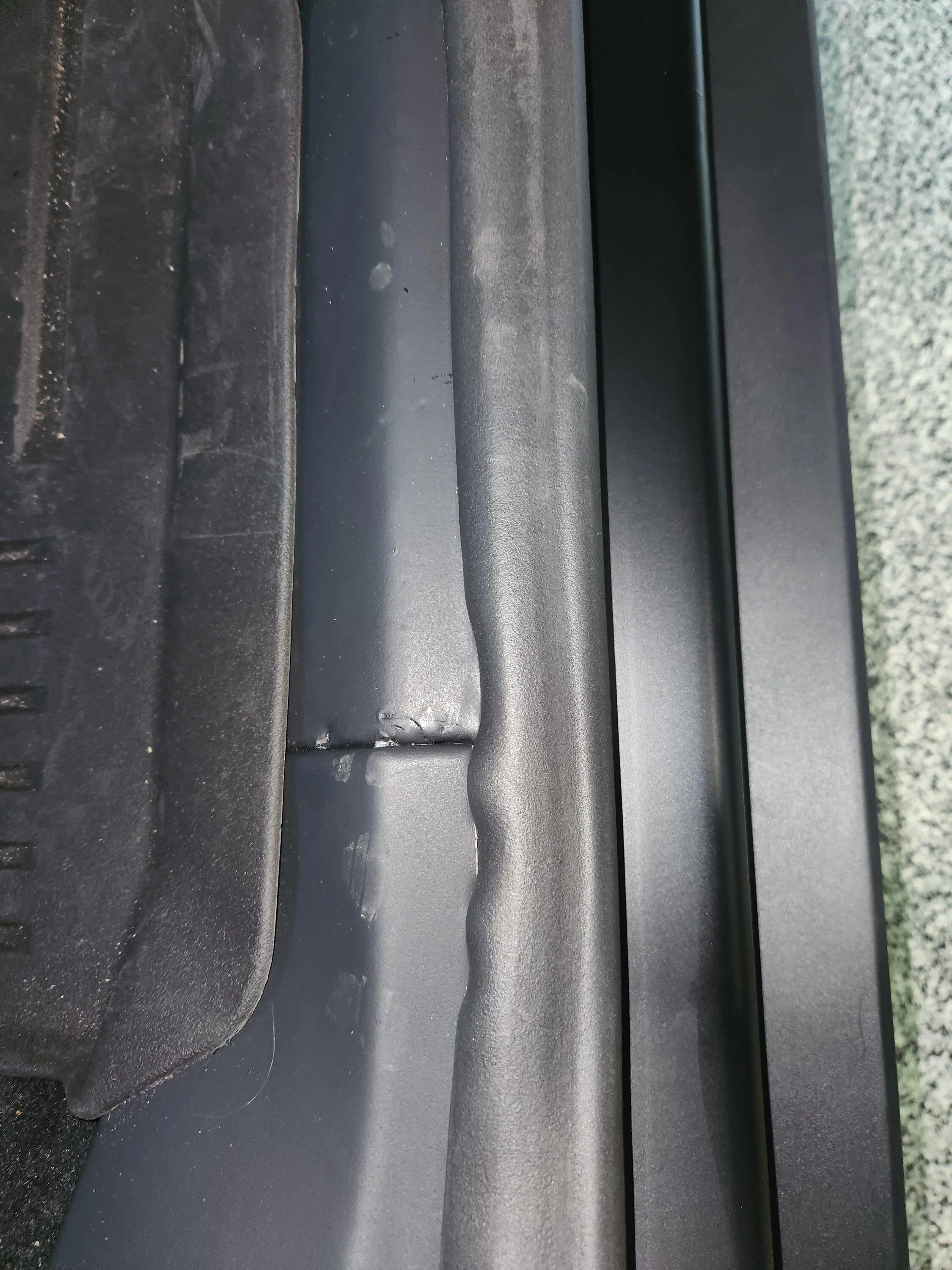 Tesla Cybertruck Rear passenger interior side sill foam material -- permanent markings / tears 20240514_095620