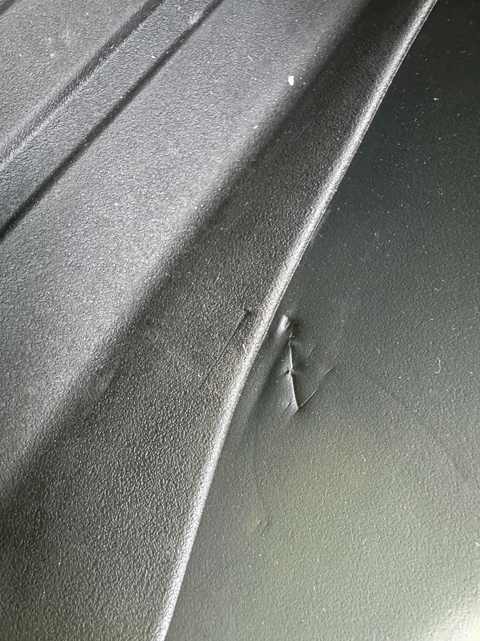 Tesla Cybertruck Rear passenger interior side sill foam material -- permanent markings / tears IMG_2796
