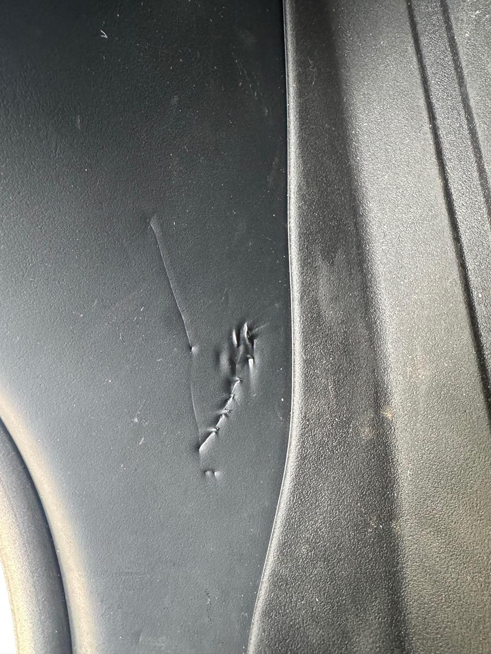 Tesla Cybertruck Rear passenger interior side sill foam material -- permanent markings / tears IMG_2795