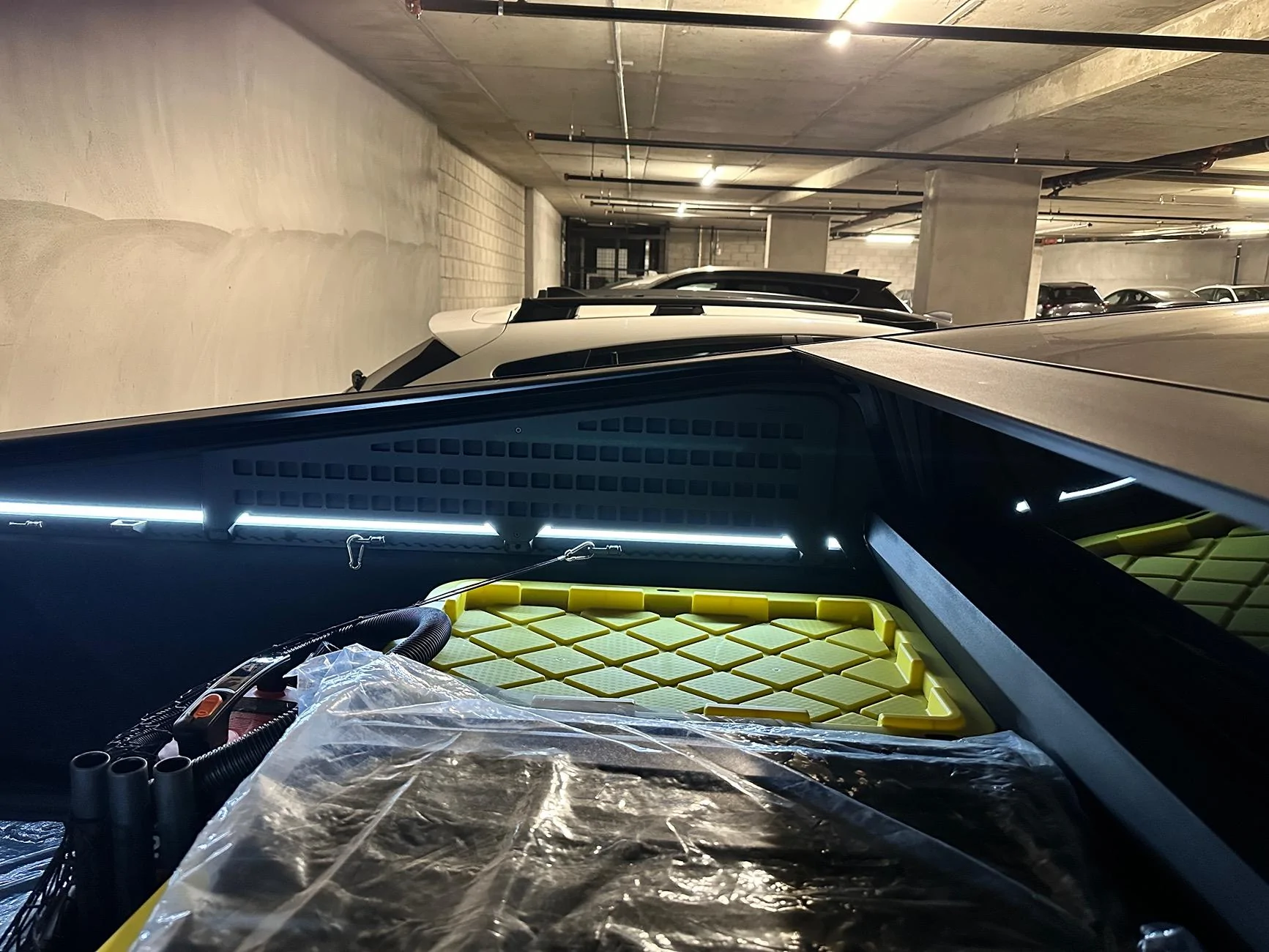 Tesla Cybertruck Careful when installing bed MOLLE Panels -- don't lose retaining nut in hole on L-track IMG_1575