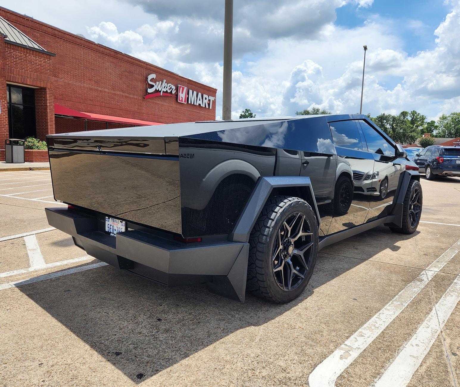 Tesla Cybertruck Gloss Black Cybertruck on 24" Wheels (4PLAY) and Nitto Ridge Grappler A/T Tires 295/45R24 Gloss Black Cybertruck on 24%22 Wheels (4PLAY) and Nitto Ridge Grappler A:T Tires 295:45R24 3