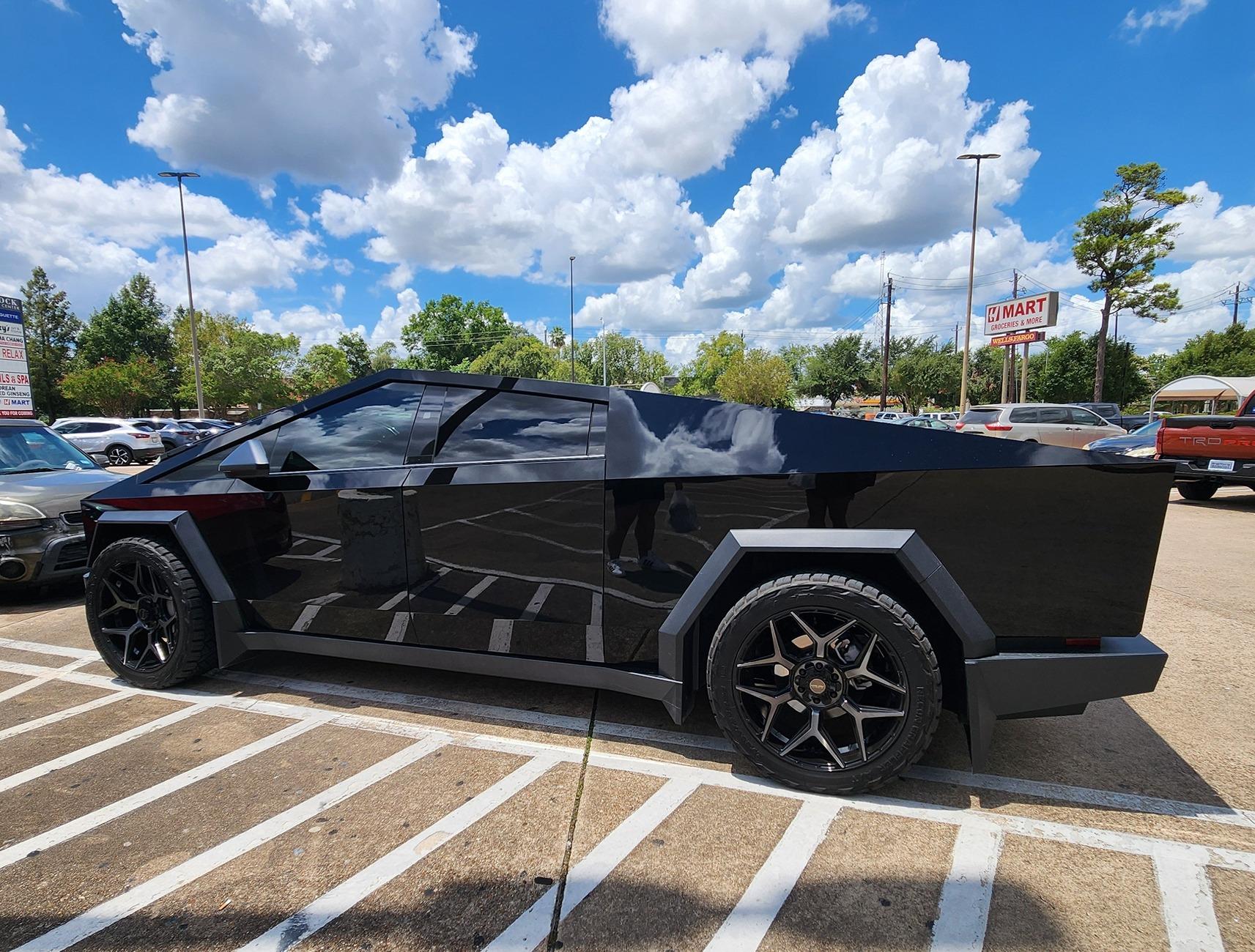 Tesla Cybertruck Gloss Black Cybertruck on 24" Wheels (4PLAY) and Nitto Ridge Grappler A/T Tires 295/45R24 Gloss Black Cybertruck on 24%22 Wheels (4PLAY) and Nitto Ridge Grappler A:T Tires 295:45R24 2