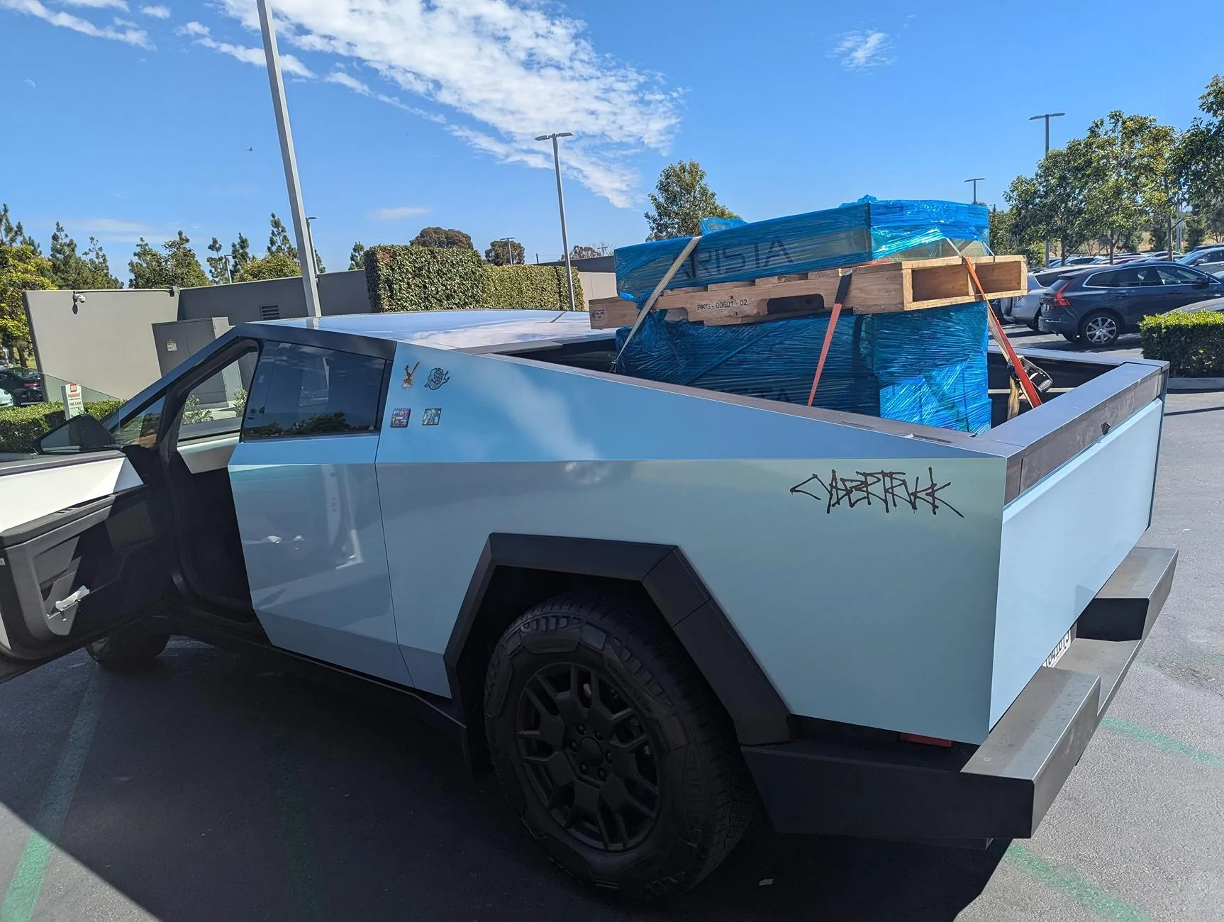 Tesla Cybertruck Cybertruck doing Cyber stuff -- hauling two full-sized server racks (42U) CT pallets of gear
