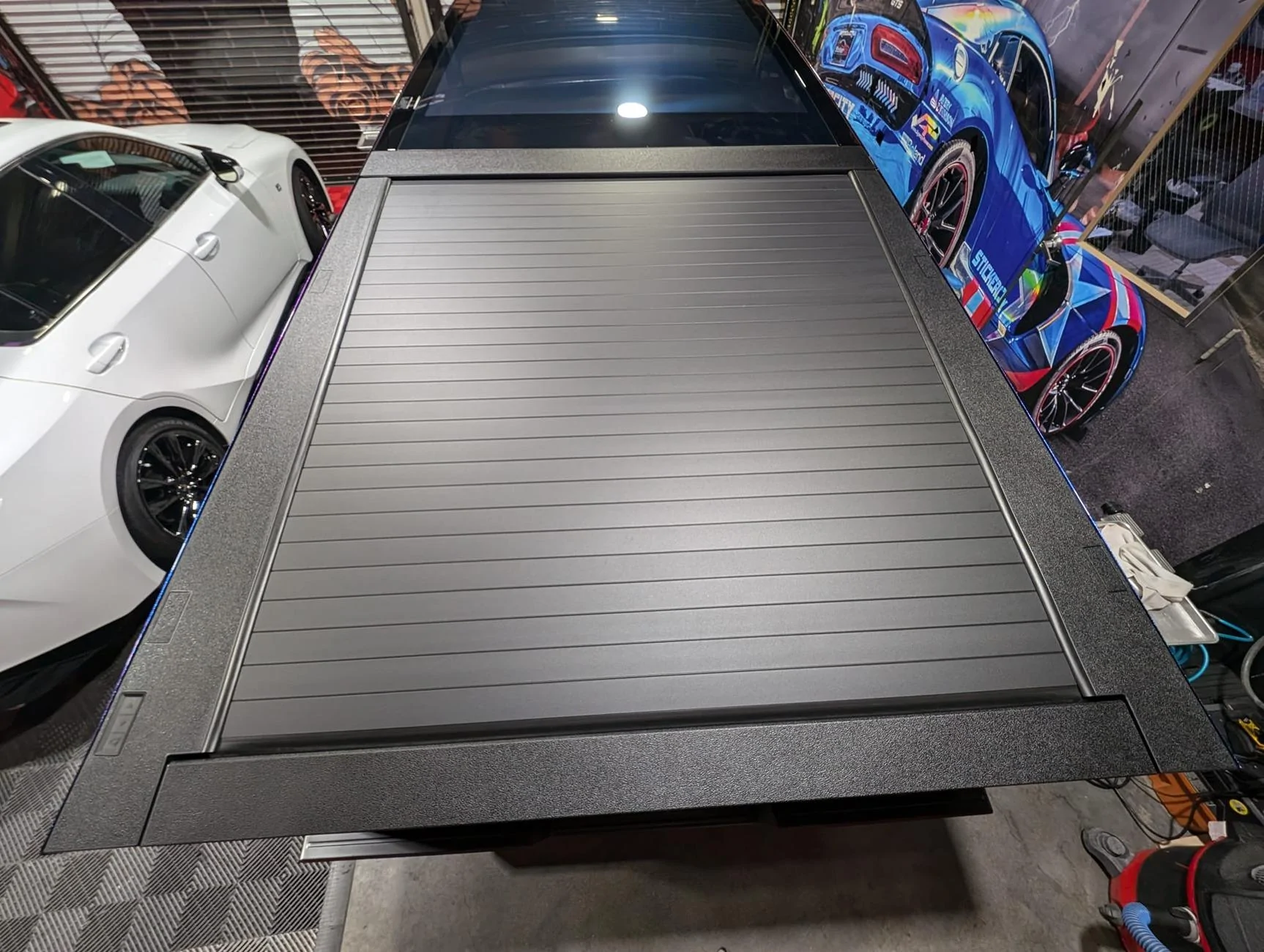 Tesla Cybertruck DIY fender flares, bumpers and rocker panels vinyl wrap kits by Sticker City Cargo Bed Surround restyling and protection