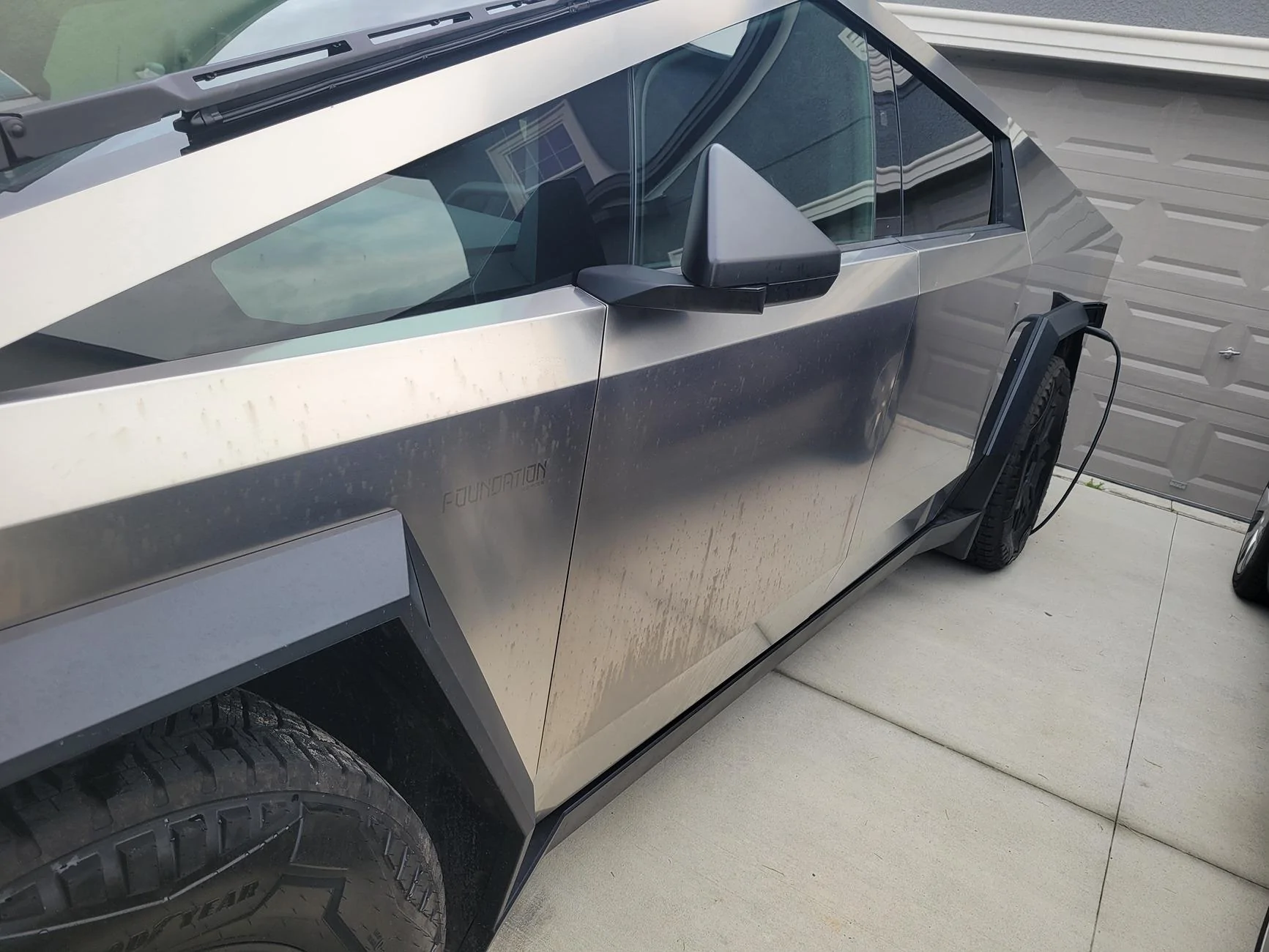 Tesla Cybertruck Lawn treatment or pesticide damaged / stained exterior 20240822_191038