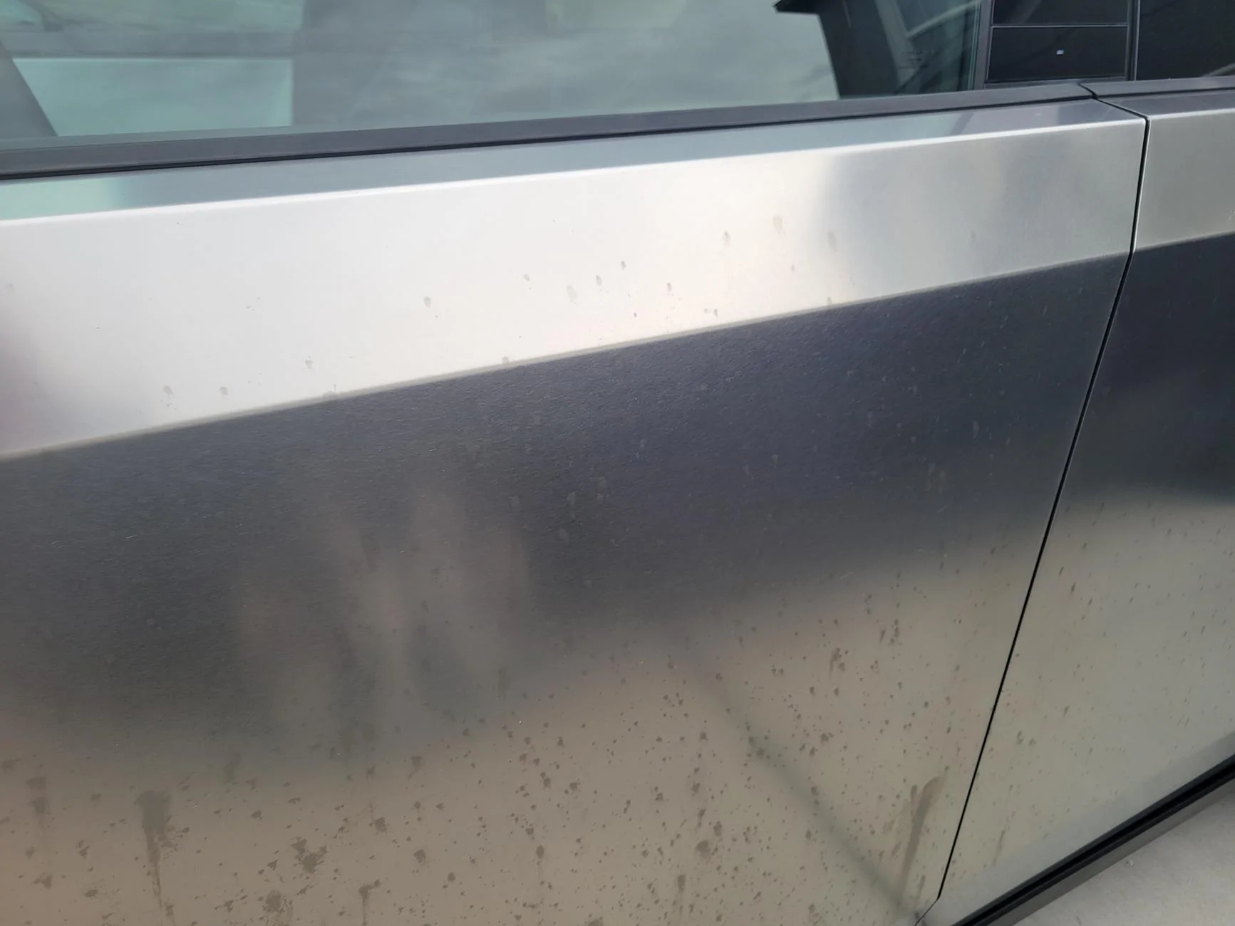 Tesla Cybertruck Lawn treatment or pesticide damaged / stained exterior 20240822_191043