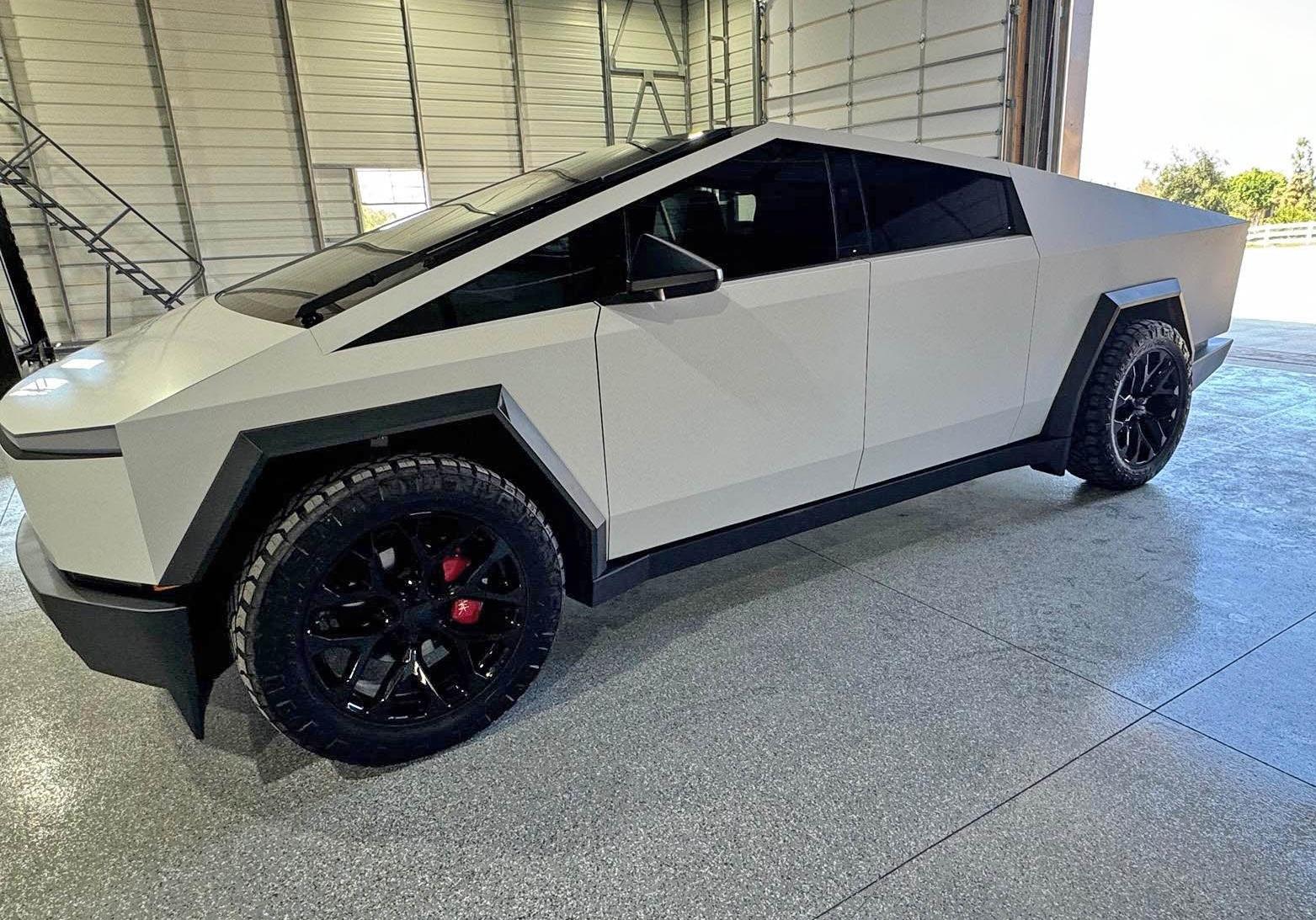 Tesla Cybertruck New Wrap (Satin White), Aftermarket Wheels, Nitto Ridge Grappler Tires, Painted Brakes Calipers w/ Cybertruck Logo IMG_0099
