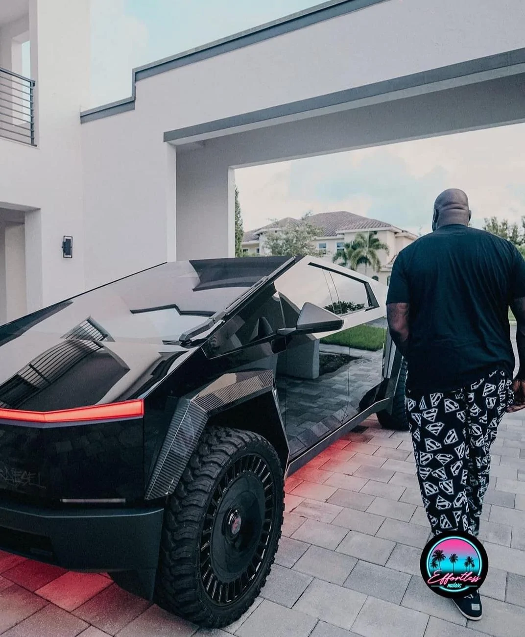 Tesla Cybertruck Shaq gets his second Cybertruck -- carbon wide fenders, 26" wheels, gloss black wrap + underbody lighting Shaq cybertruck black wra