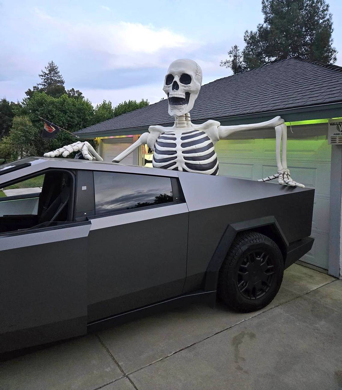 cybertruck halloween skeleton in bed.jpg