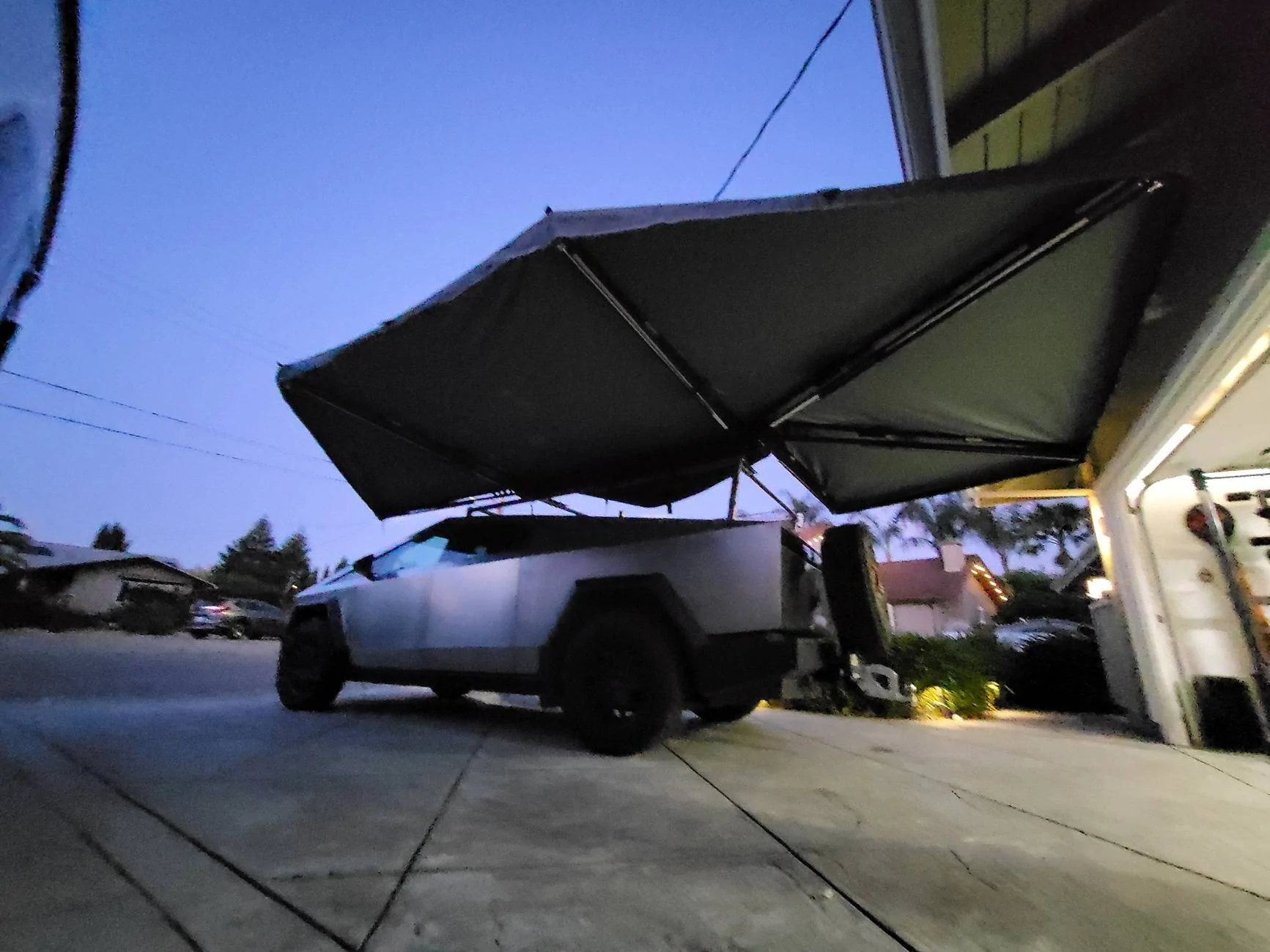 Tesla Cybertruck Spare tire roof rack installed on lower racks on my Cybertruck 20240514_203522