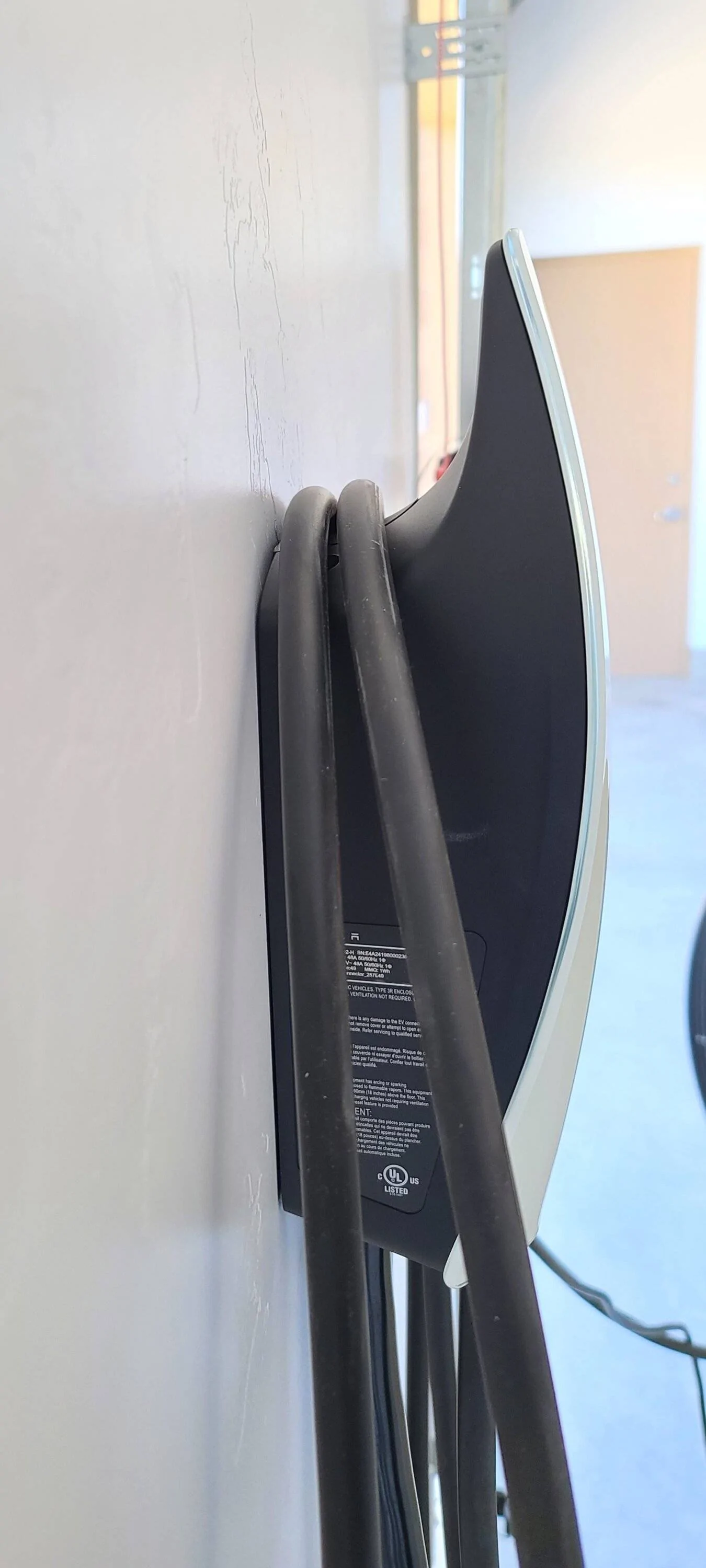 Tesla Cybertruck Any accessory to keep docked charging cable (Tesla home charger) from rubbing against garage wall? 20240923_080419