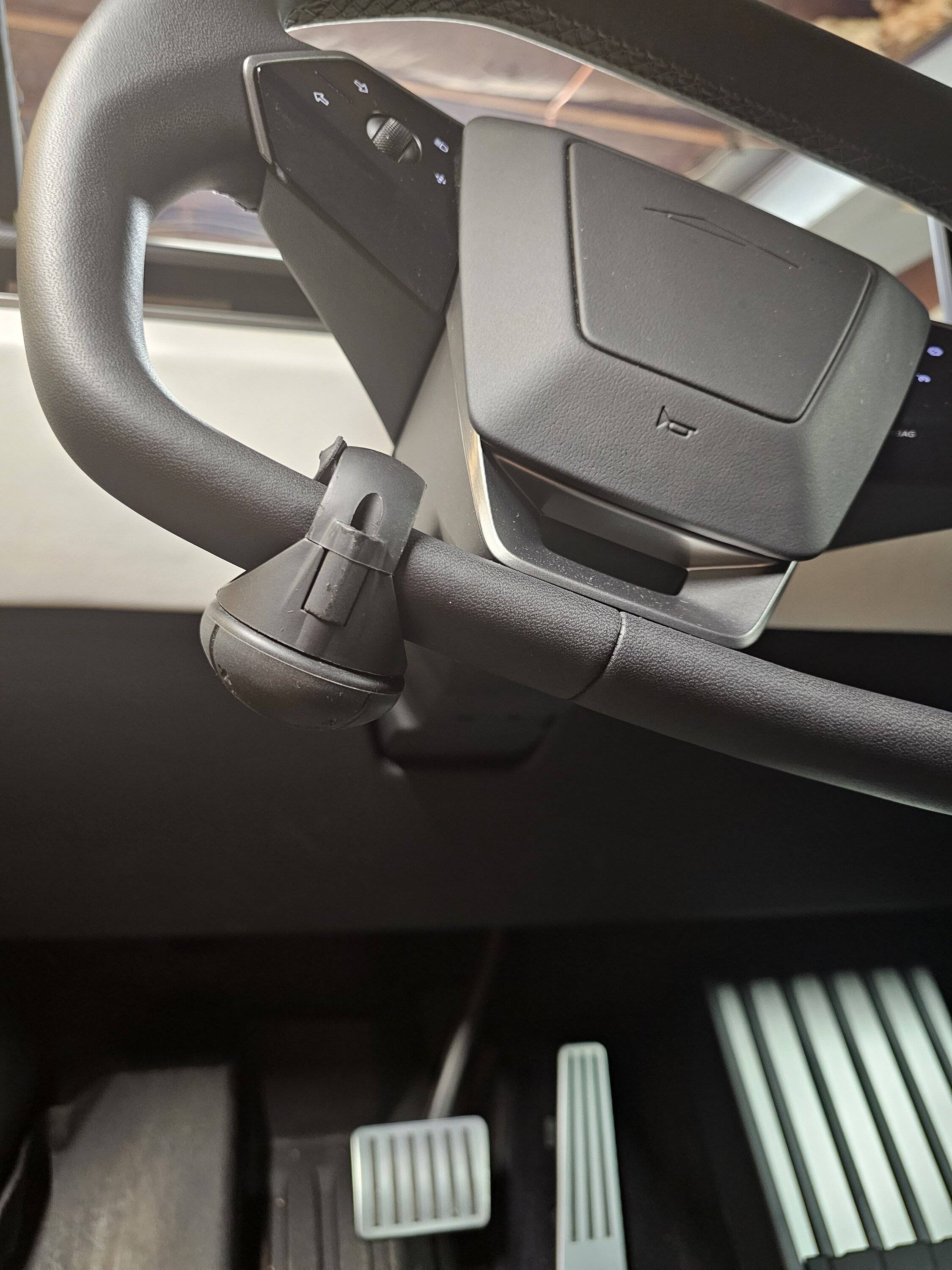 Tesla Cybertruck Knee Steering Knob + Elevated Wireless Charger Pad installed 20240930_083938