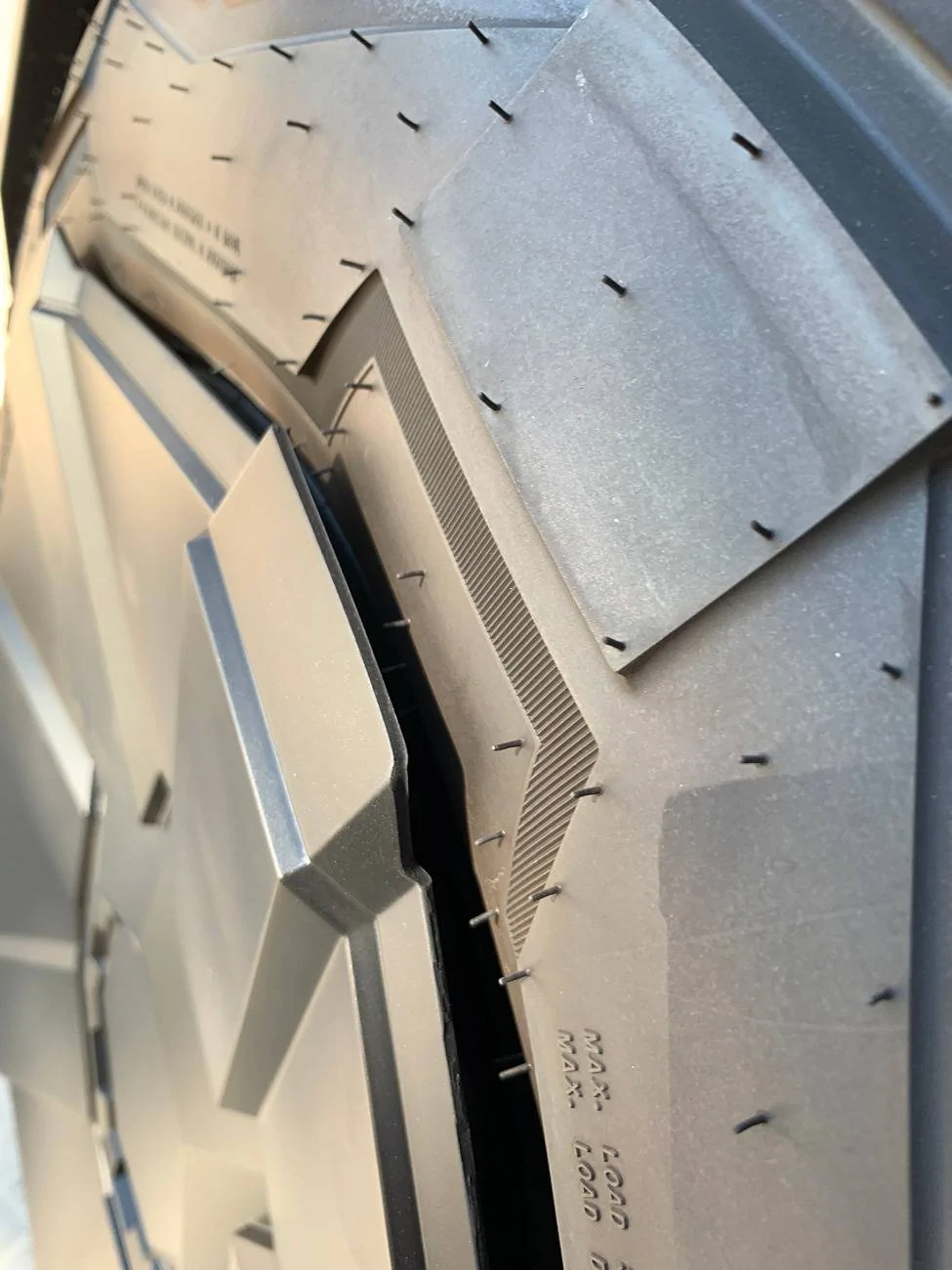 Tesla Cybertruck New Wheel Cover still rubs tire sidewalls -- check your Cybertruck IMG_3270