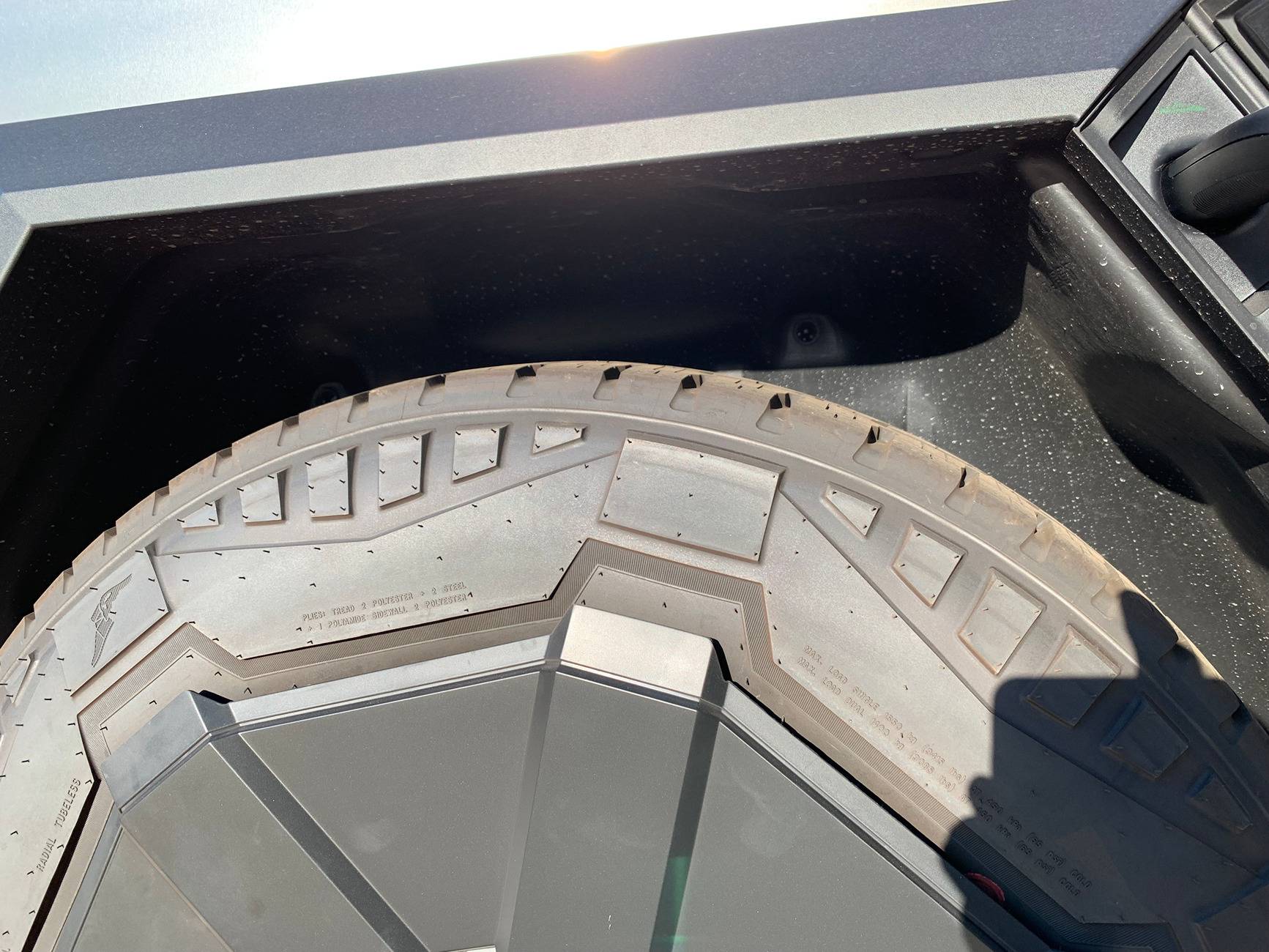 Tesla Cybertruck New Wheel Cover still rubs tire sidewalls -- check your Cybertruck IMG_3271