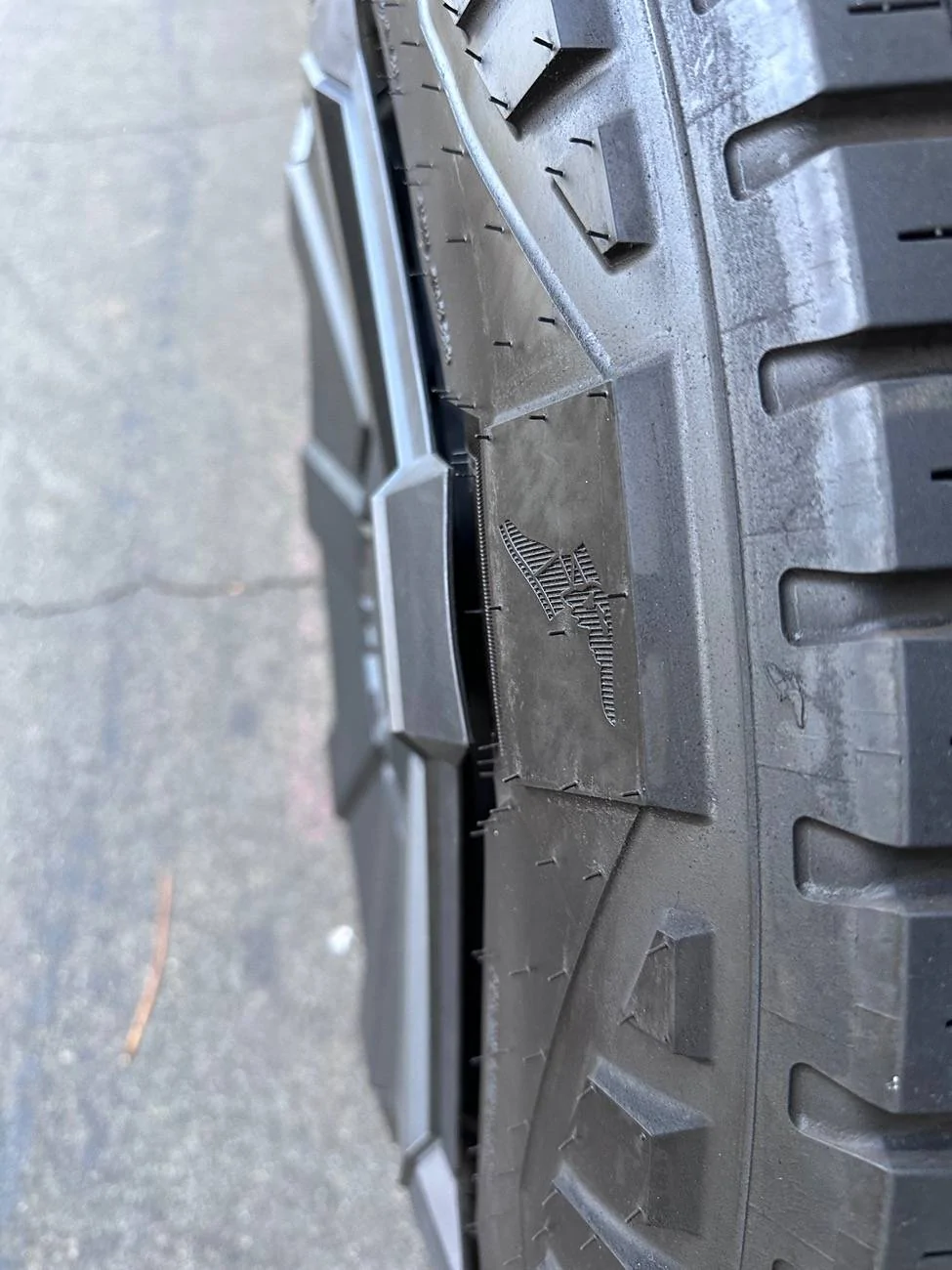 Tesla Cybertruck New Wheel Cover still rubs tire sidewalls -- check your Cybertruck IMG_6129