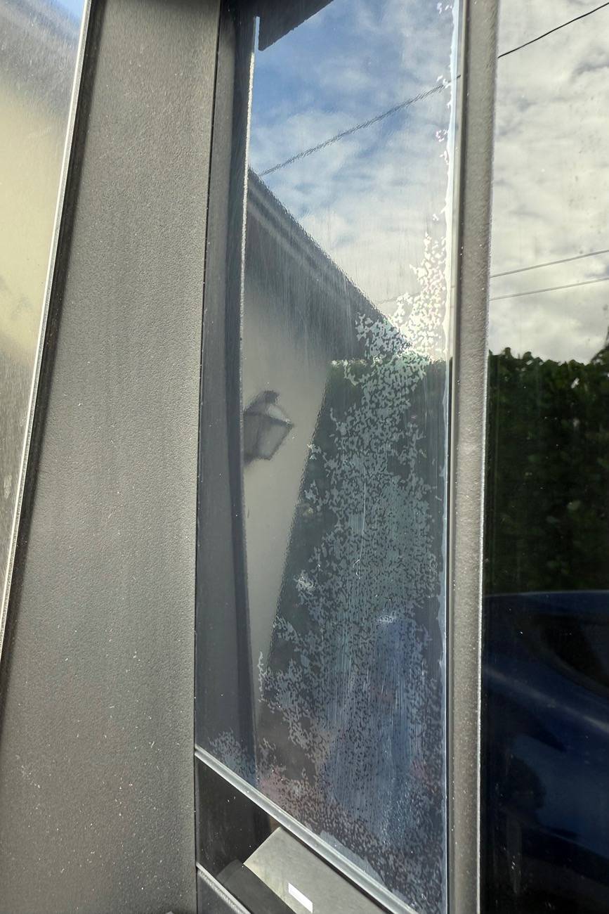 Tesla Cybertruck Small glass pane degrading above door button IMG_2046