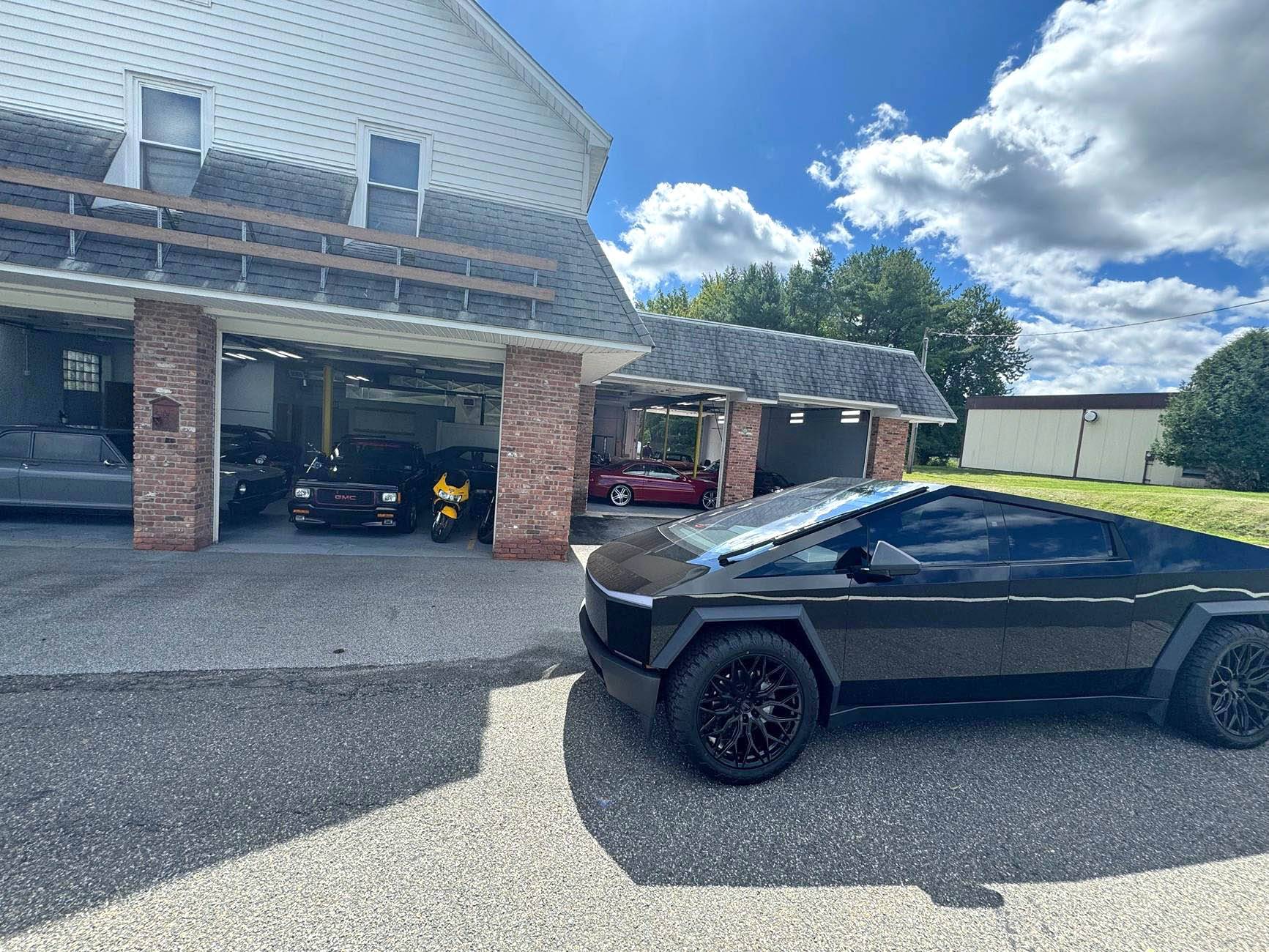 Tesla Cybertruck Gloss Black Wrap with 24" Vossen Wheels, doing truck hauling work IMG_3692