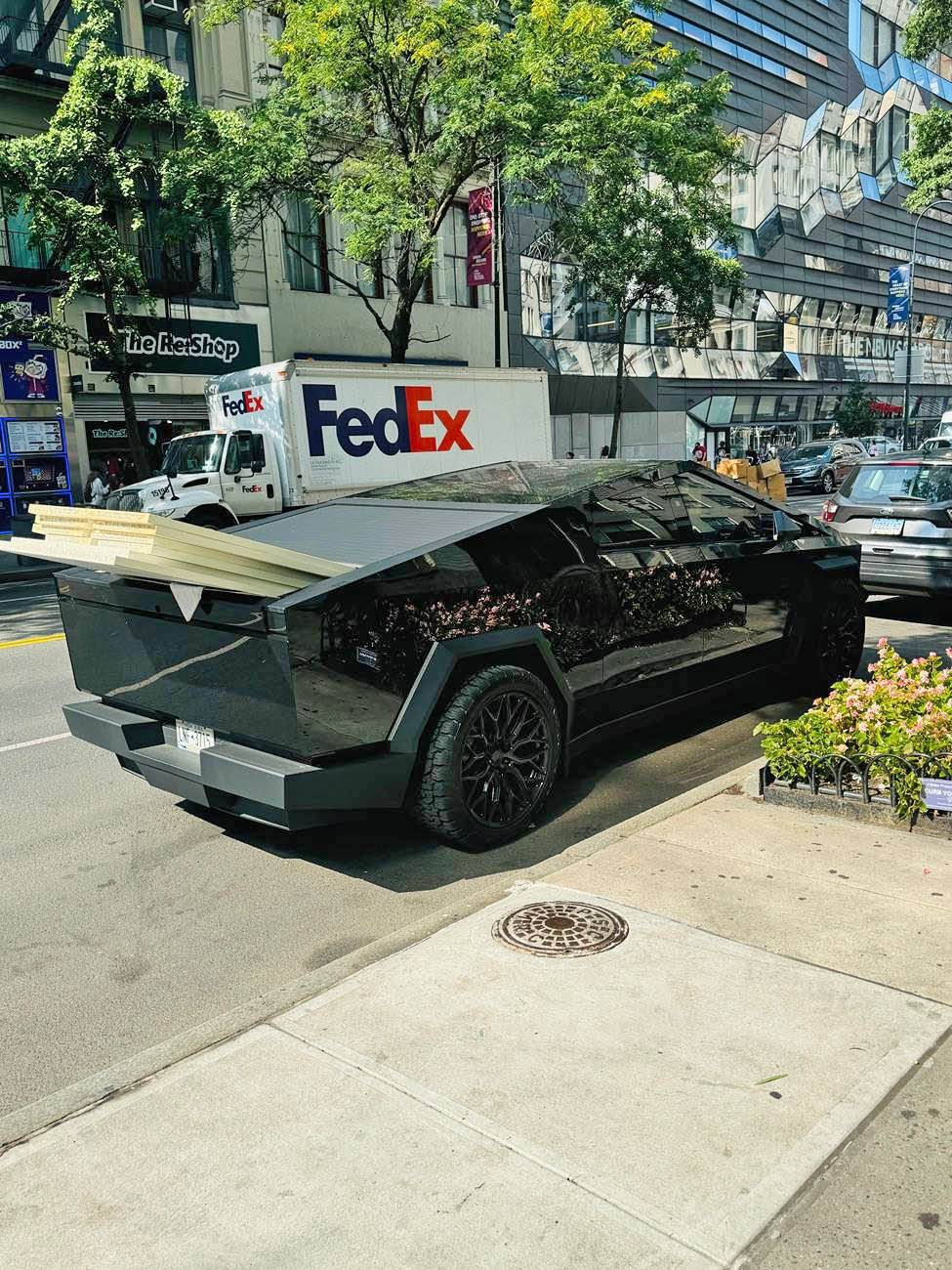 Tesla Cybertruck Gloss Black Wrap with 24" Vossen Wheels, doing truck hauling work IMG_3838