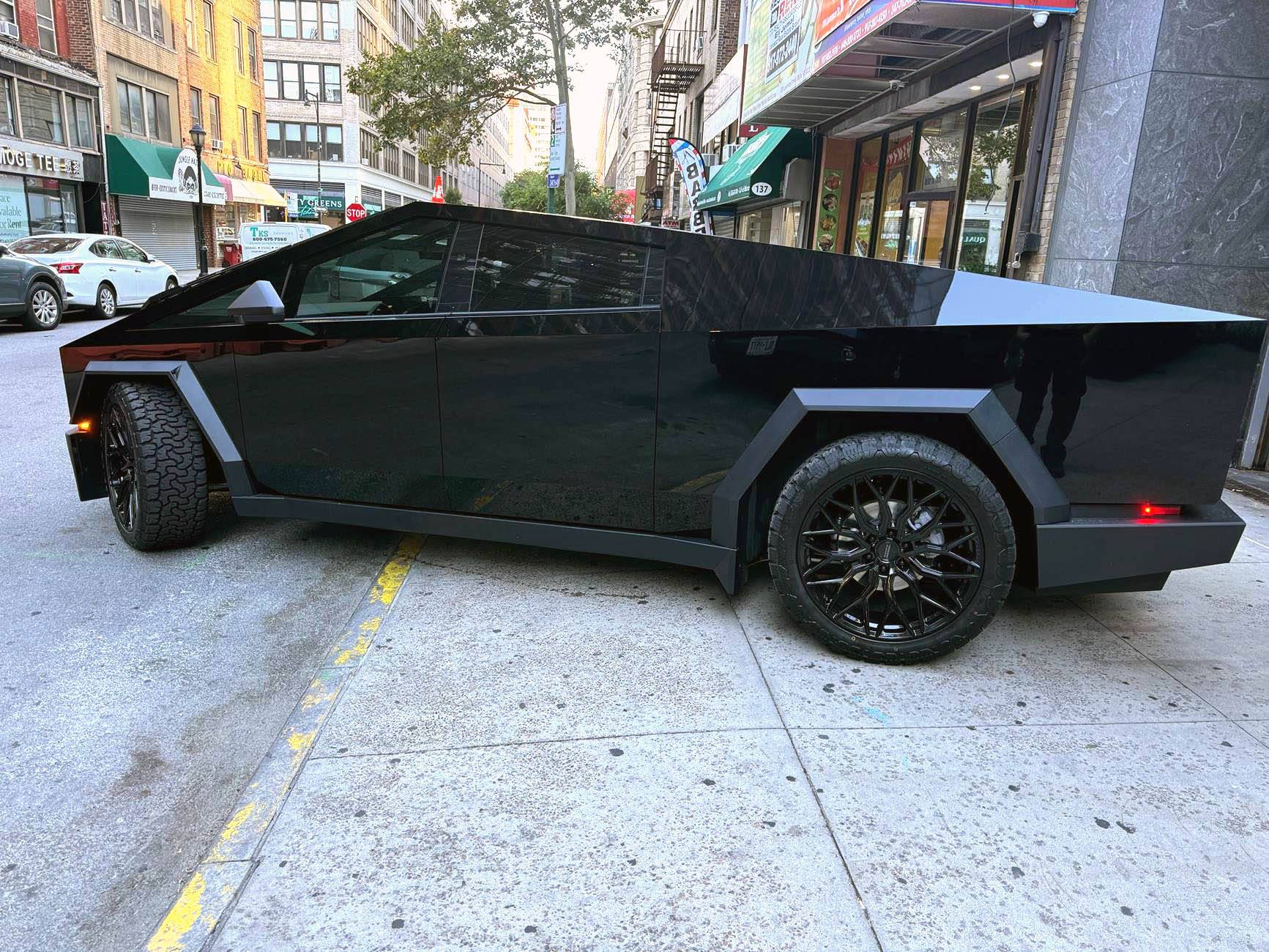 Tesla Cybertruck Gloss Black Wrap with 24" Vossen Wheels, doing truck hauling work IMG_3544