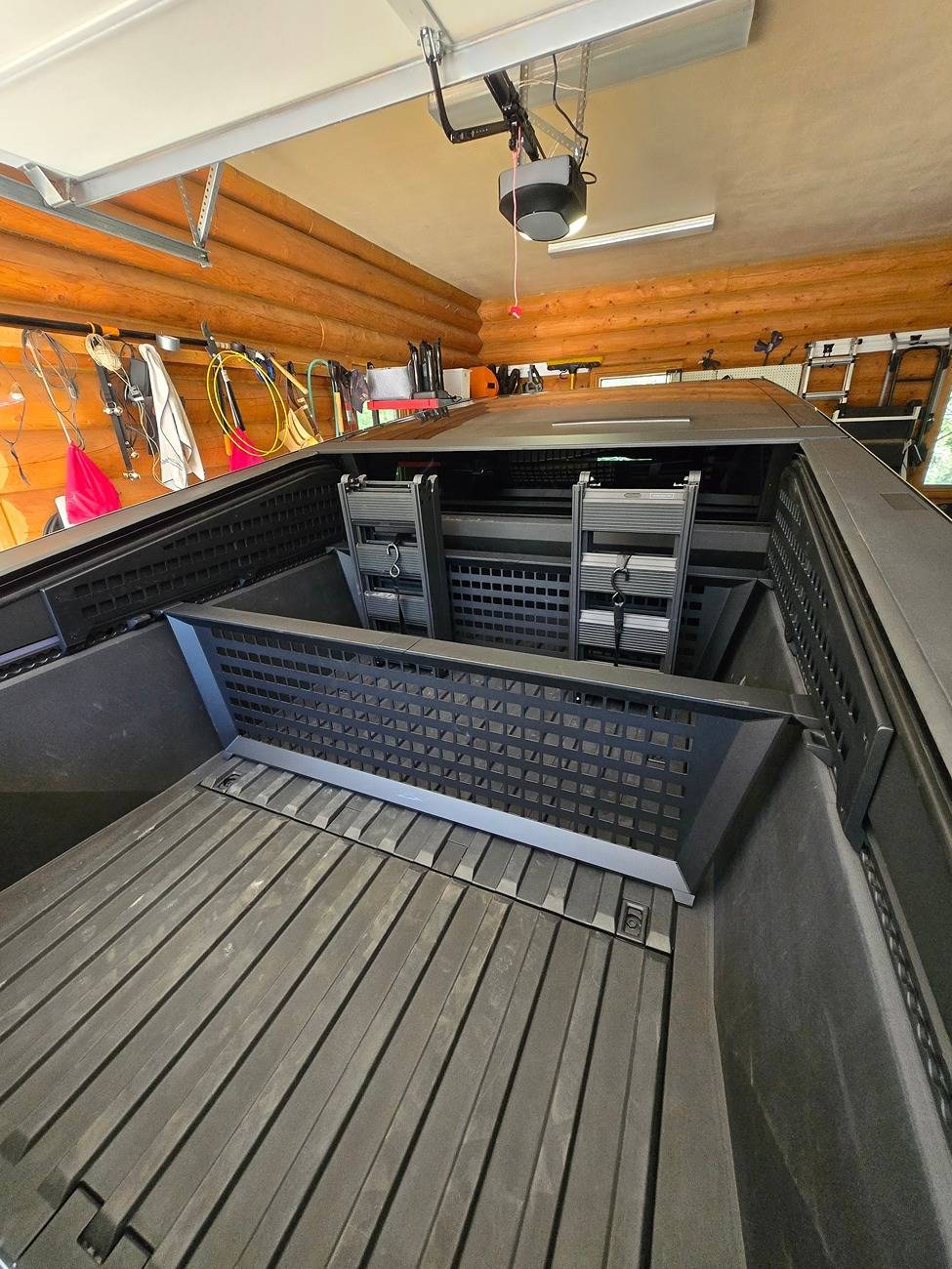 Tesla Cybertruck Storing Tesla Tailgate Ramps in Cybertruck bed - strapped to cargo divider Storing Tesla Ramps in bed - strapped to cargo divider 2